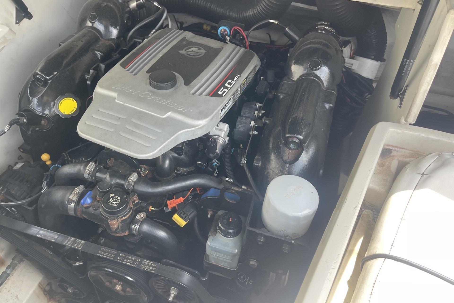Engine compartment of a 2010 Sea Ray 230 Bow Rider Select boat.