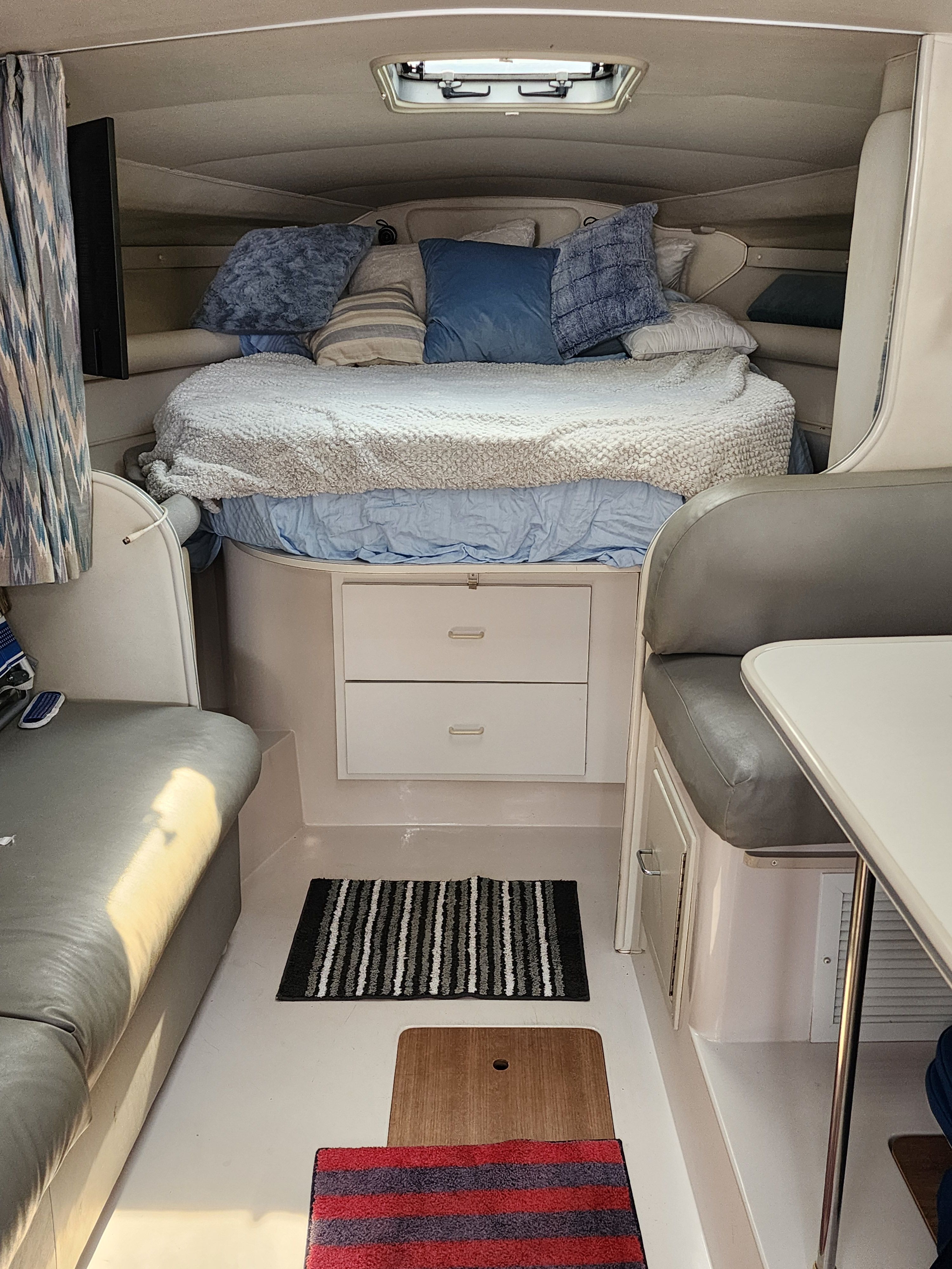 Interior of a 1990 Wellcraft St Tropez 3300 yacht with cozy bed.