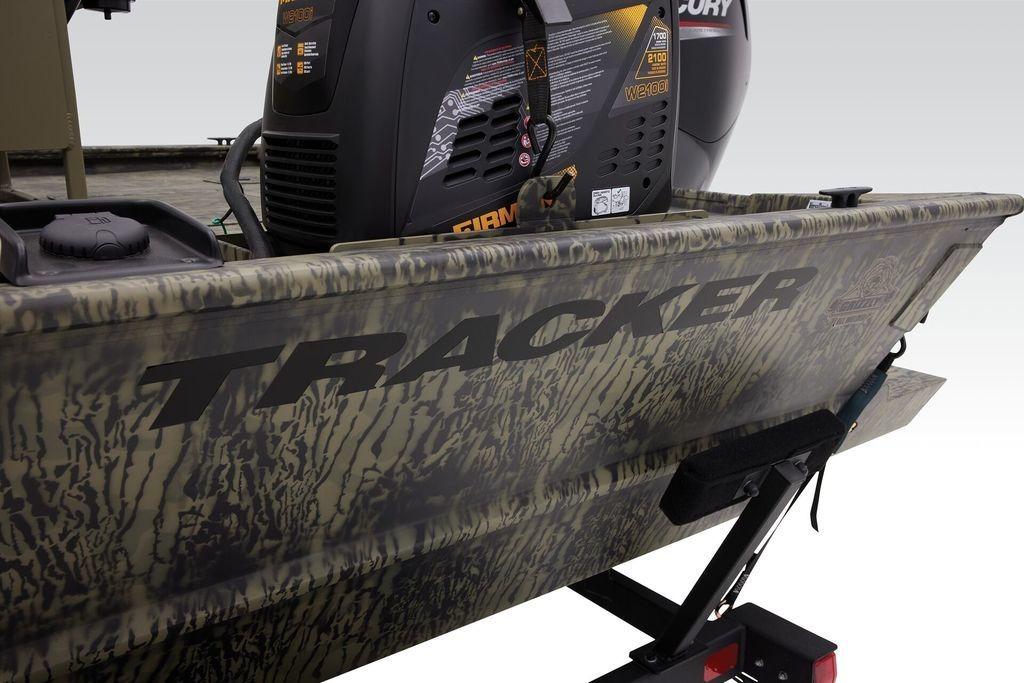 2026 Tracker GRIZZLY® 2072 CC Sportsman boat with camouflage design and Mercury engine.