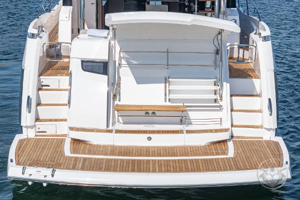 2025 Sunseeker Manhattan 68 yacht, rear view with teak deck and swim platform.