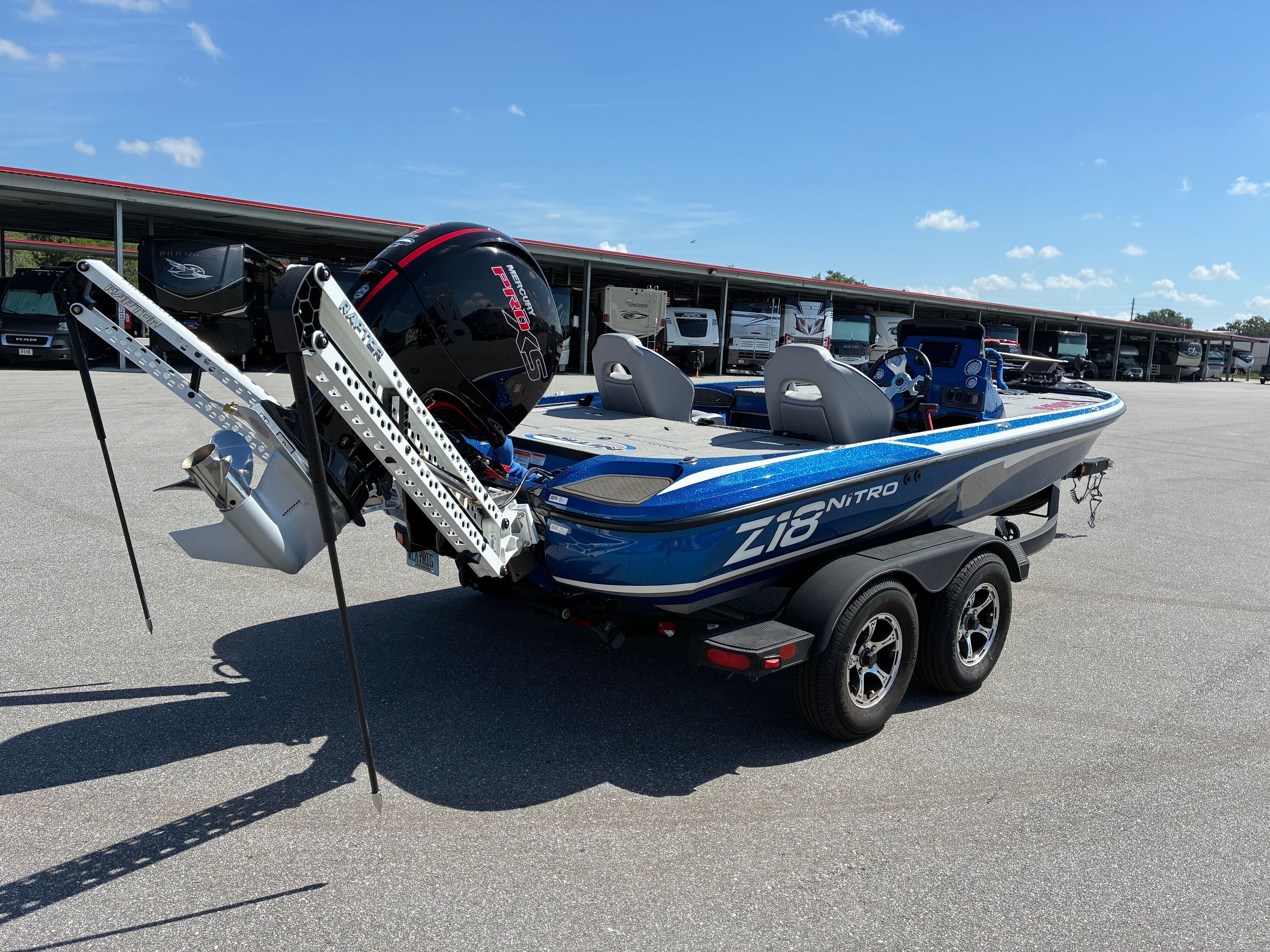 2024 Nitro Z18 Pro boat on trailer, blue sky background.