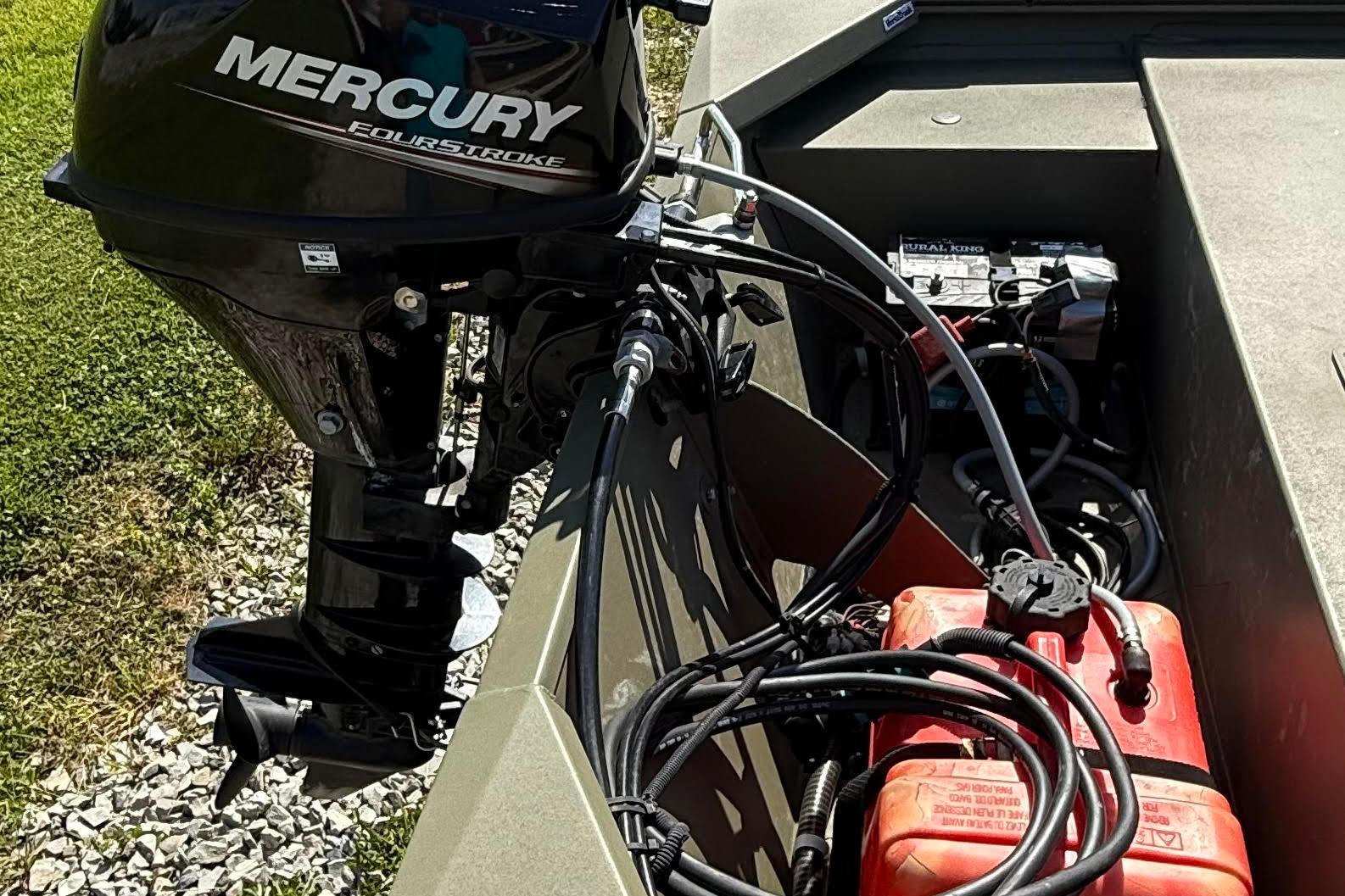 2019 Tracker Grizzly 1648 SC boat with Mercury FourStroke engine and visible wiring.