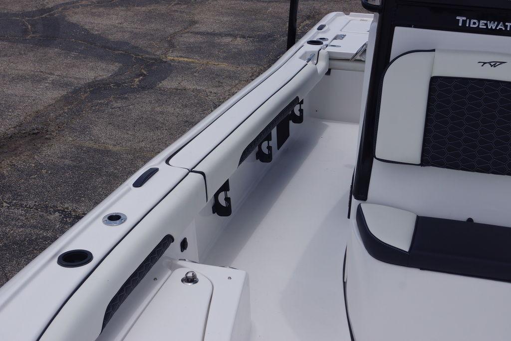 2027 Tidewater 2500 Carolina Bay boat interior with seating and rod holders.