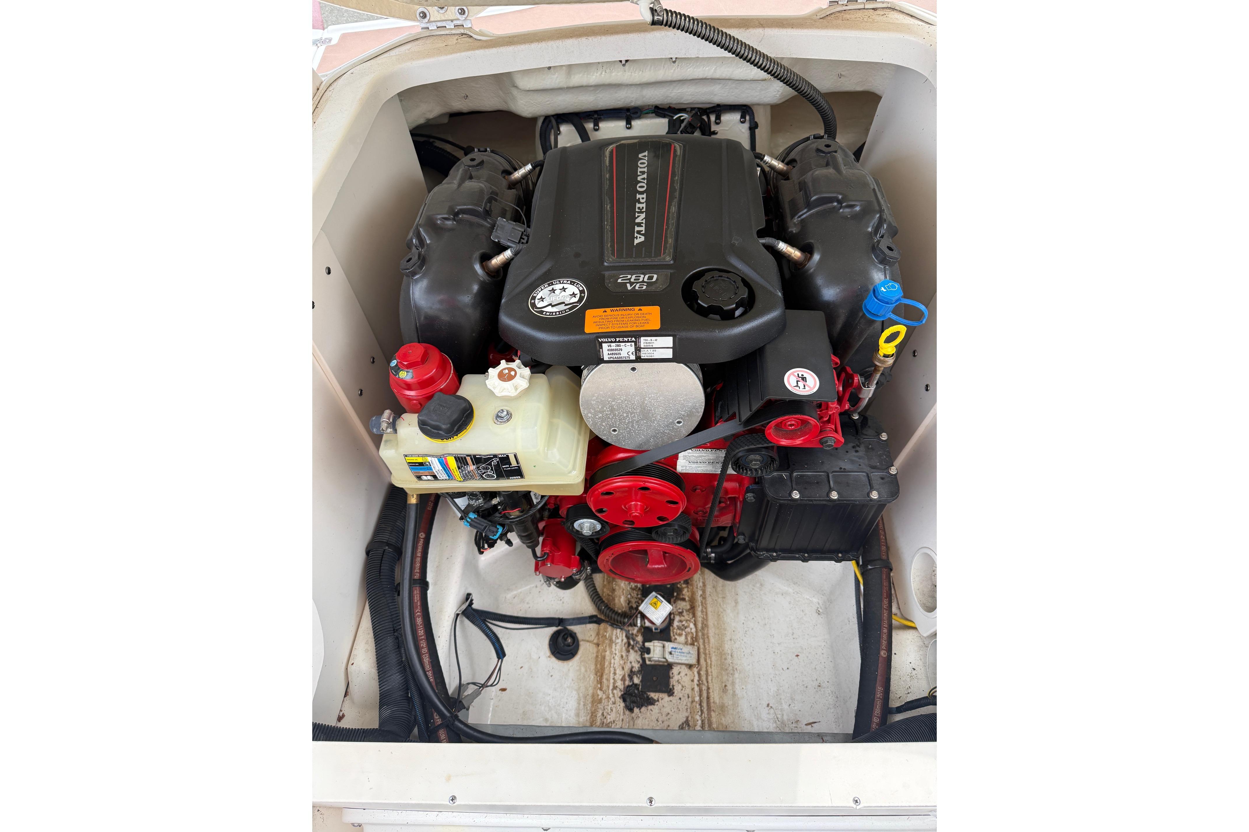 Engine compartment of 2016 Chaparral 226 SSi Wide Tech boat with Volvo Penta V6 engine.