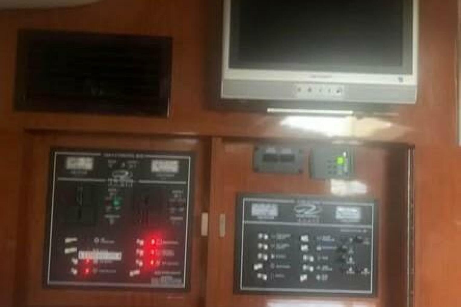 Control panel and TV inside a 2006 Regal 3060 Window Express boat.