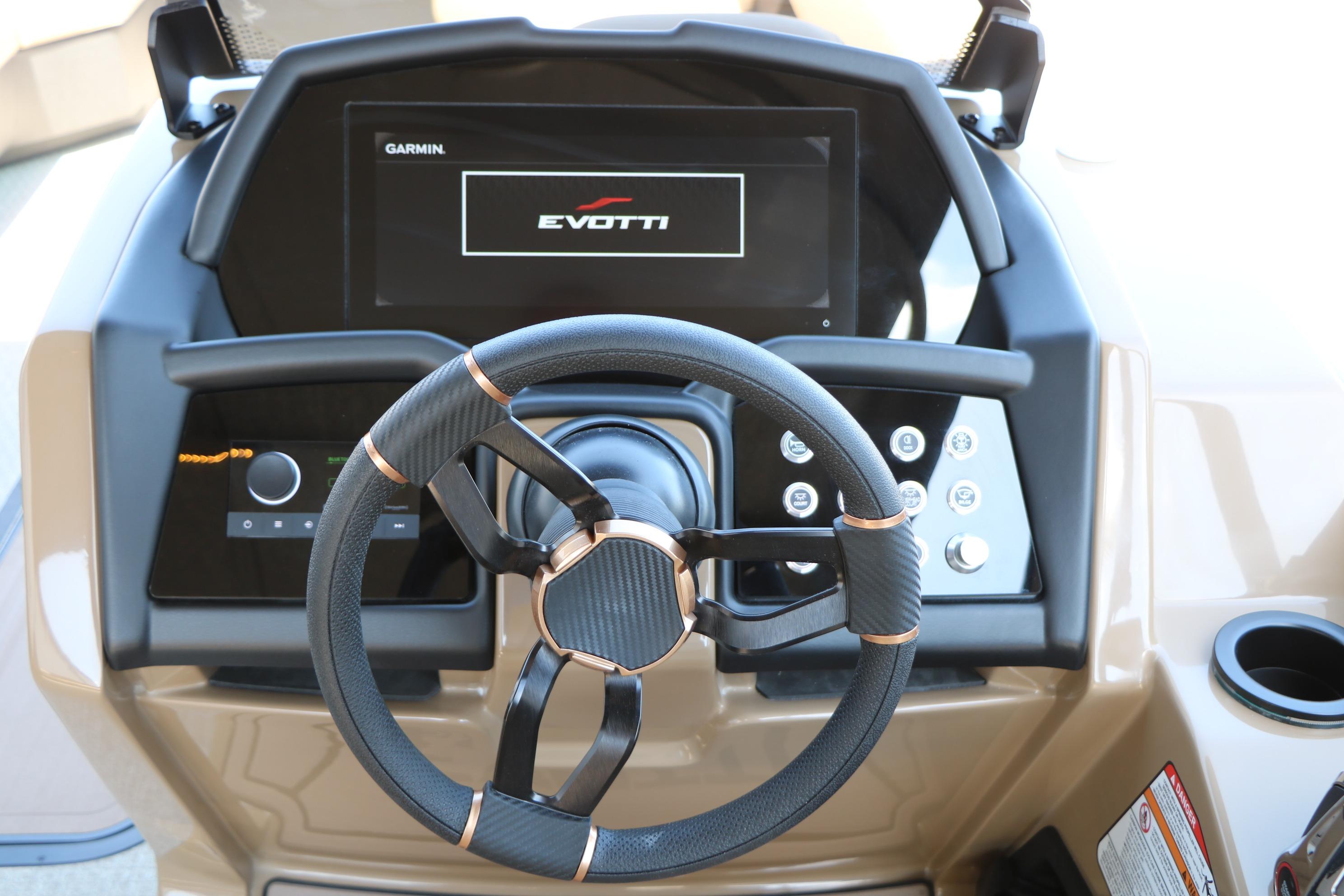 Steering console of 2026 Evotti 725 CS Tri-Toon with modern controls and display.