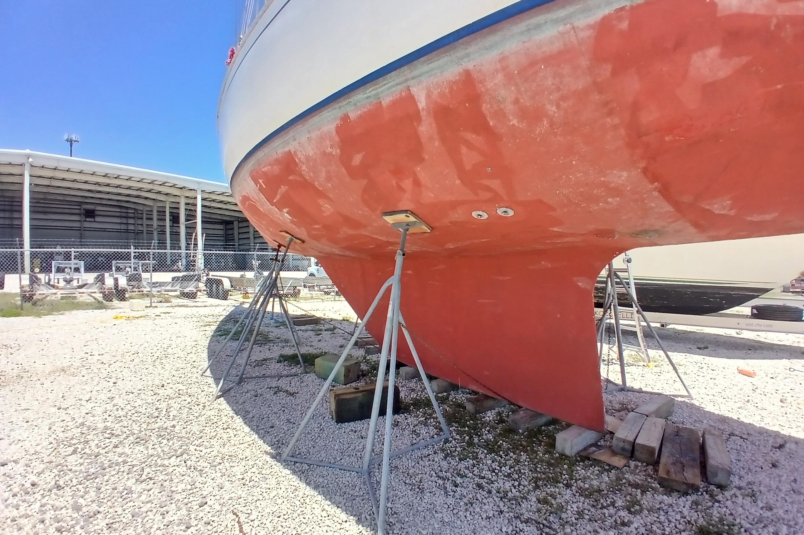 1981 Kaufman Skye 51 sailboat on stands, hull maintenance in progress.