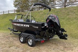 2026 Tracker Pro Guide V-175 WT boat on trailer, parked on grass.