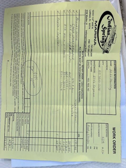 A yellow form with handwritten notes and numbers, representing a work order.
