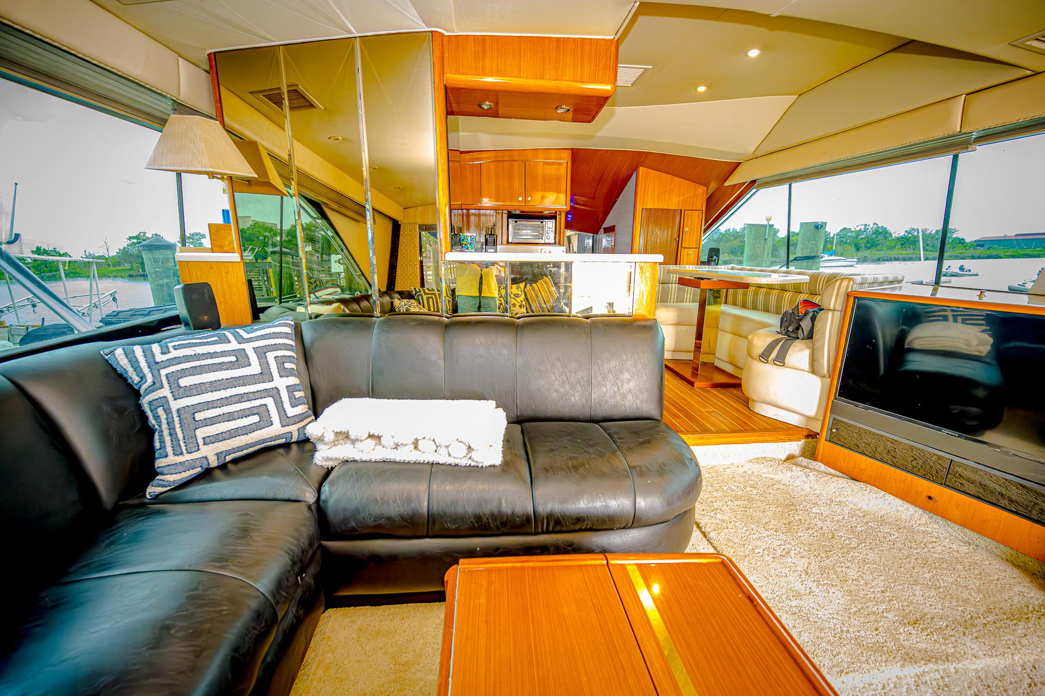 Luxurious interior of 1997 Ocean Yachts 60 Super Sport EB with leather seating and modern amenities.