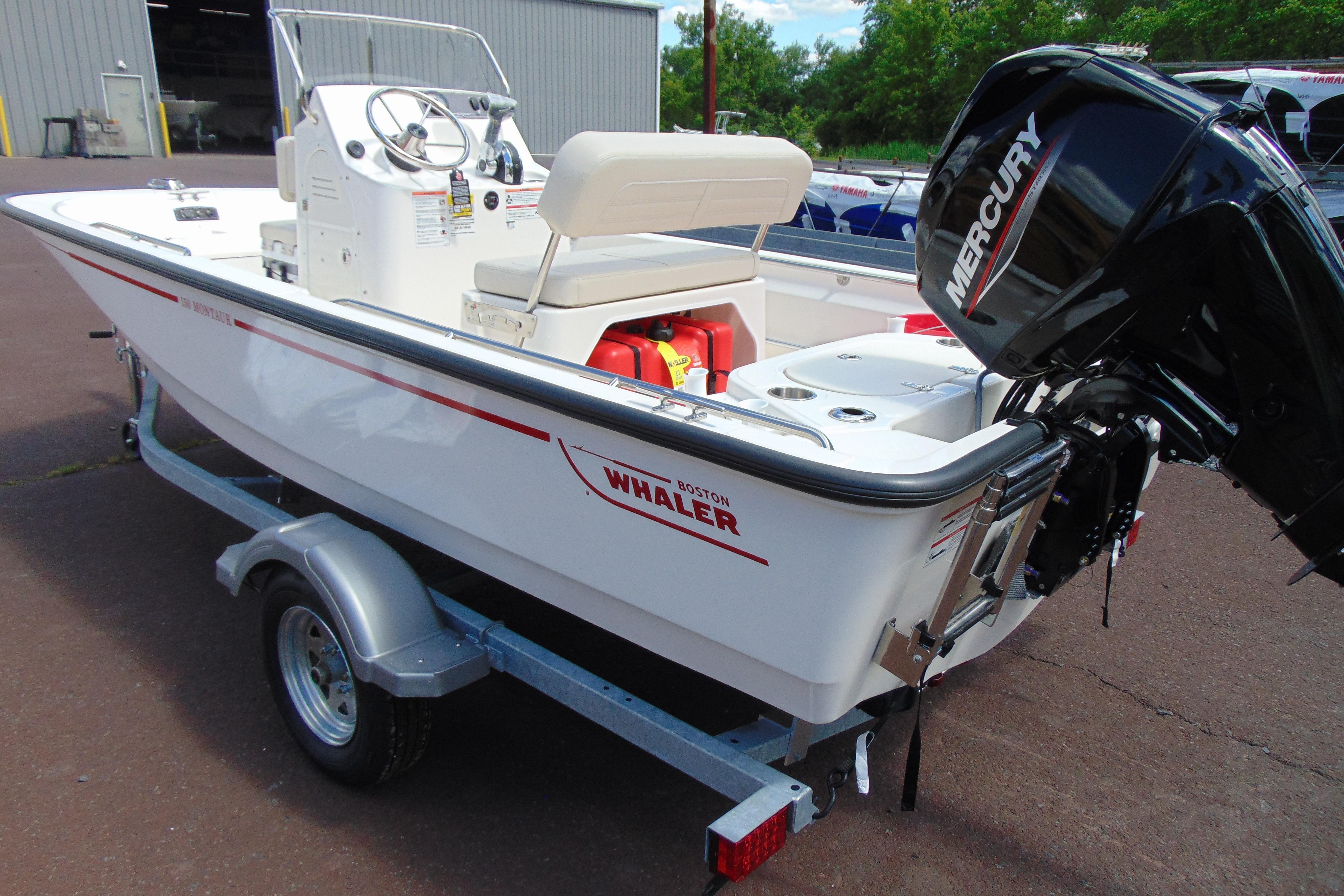 2026 Boston Whaler 150 Montauk boat with Mercury engine on trailer.