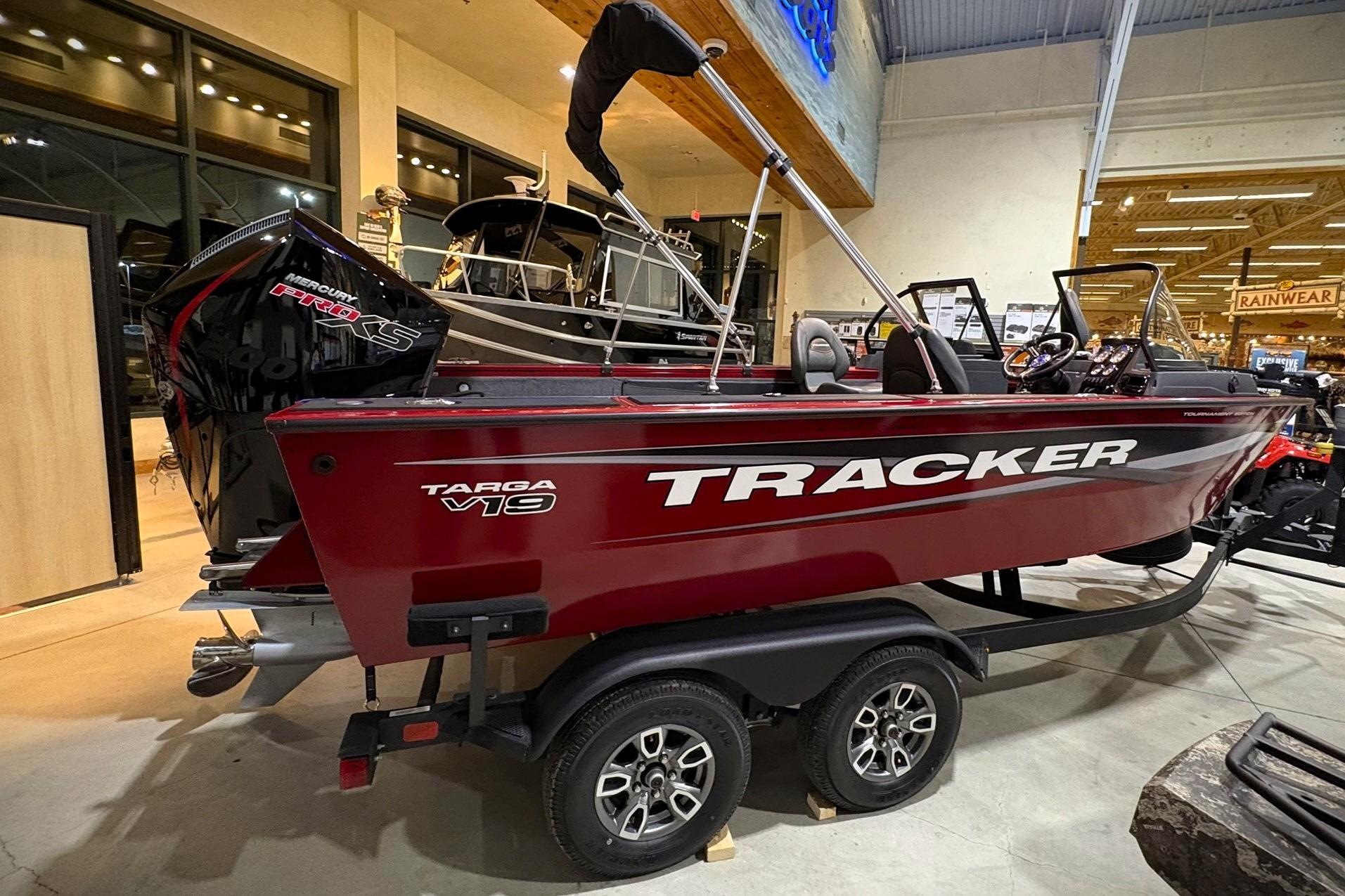 2025 Tracker Targa V-19 WT boat displayed indoors on a trailer.
