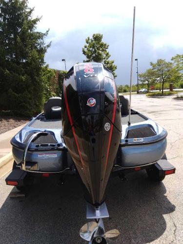 2025 Nitro Z19 boat with powerful outboard motor, parked outdoors.