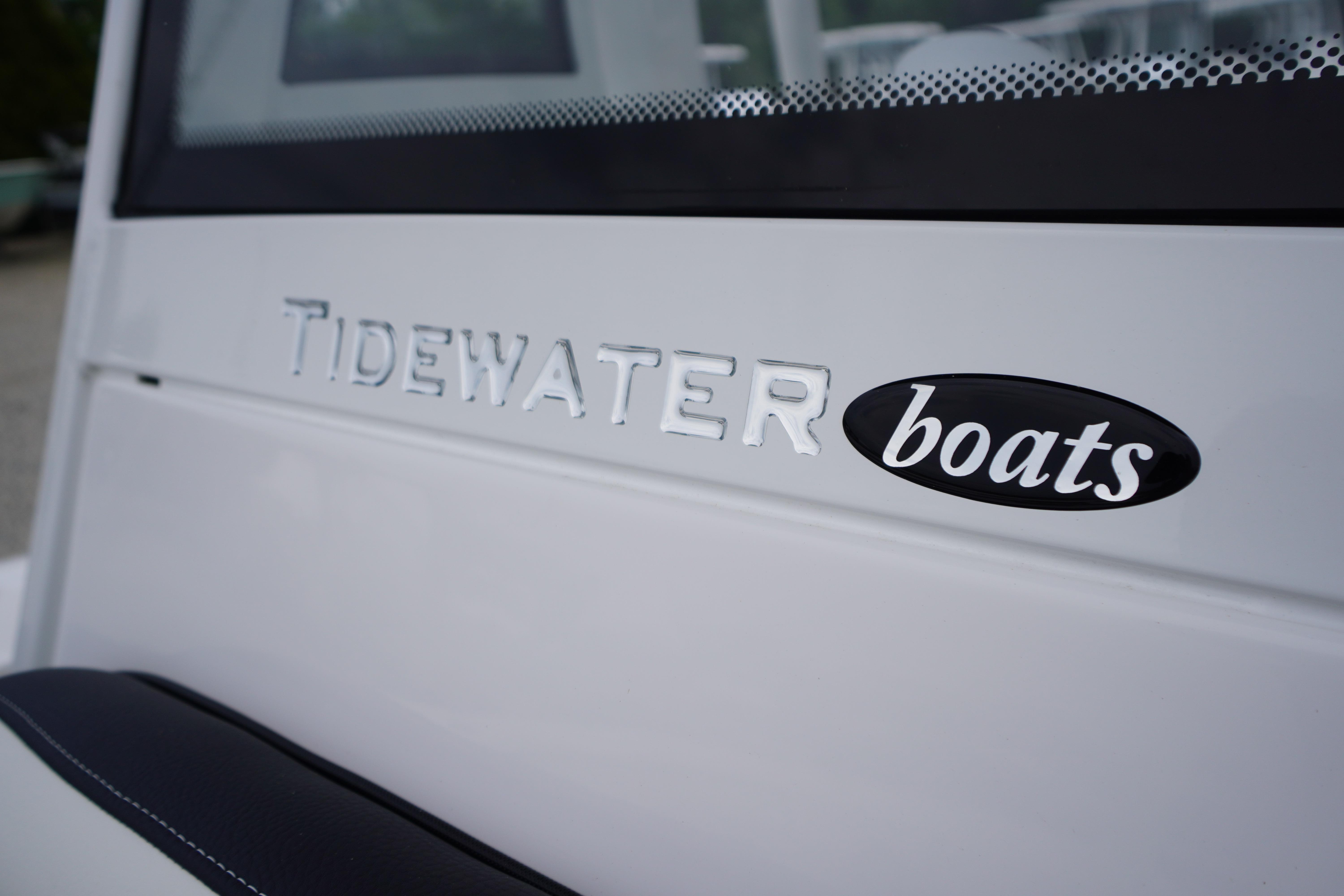 2026 Tidewater 232 SS boat logo detail on white surface.