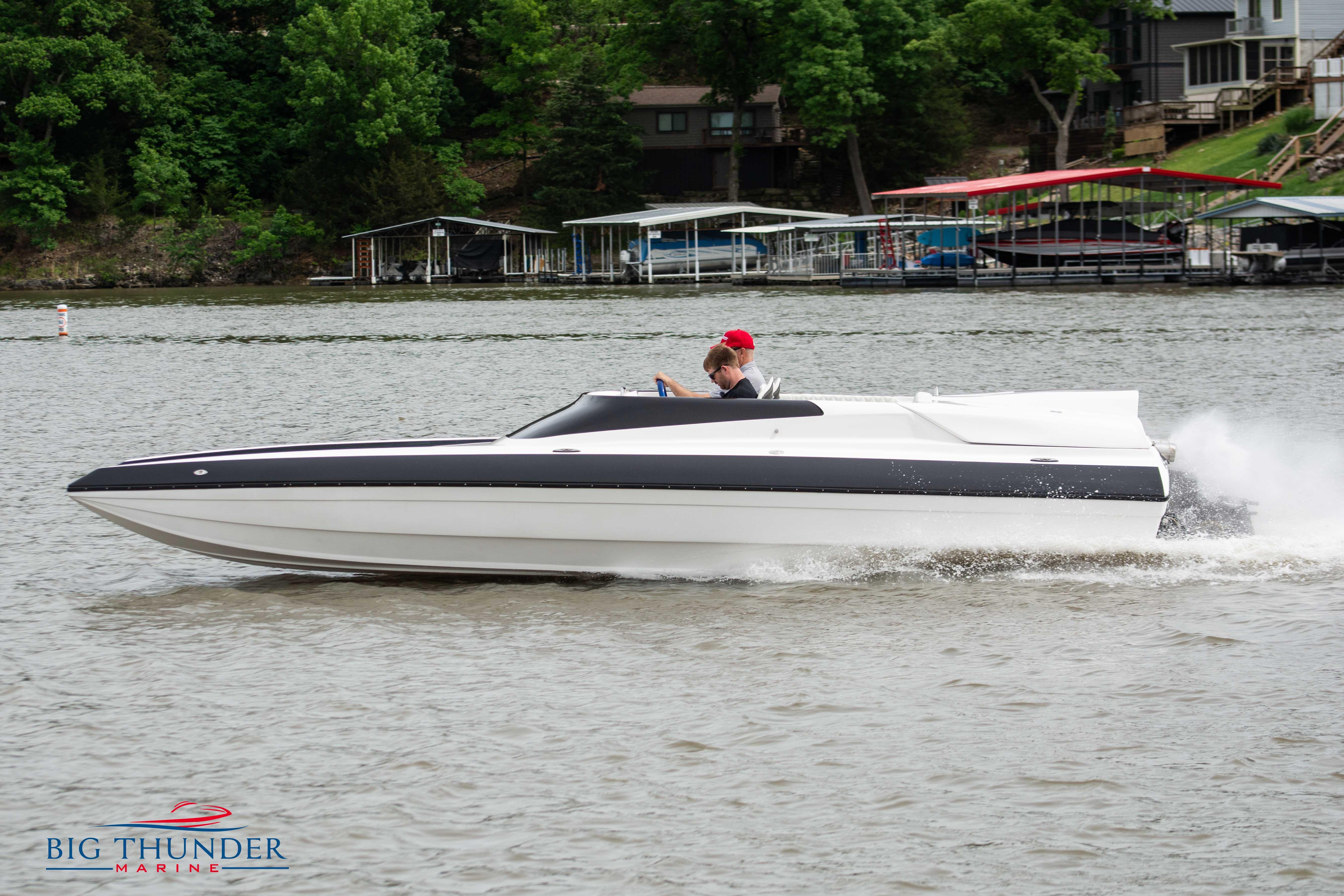 2019 Spectre Screaming Eagle 22 Talon speedboat on a lake.