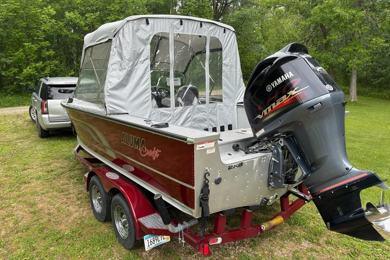 2016 Alumacraft Trophy 205 Sport boat with Yamaha outboard motor on a trailer.