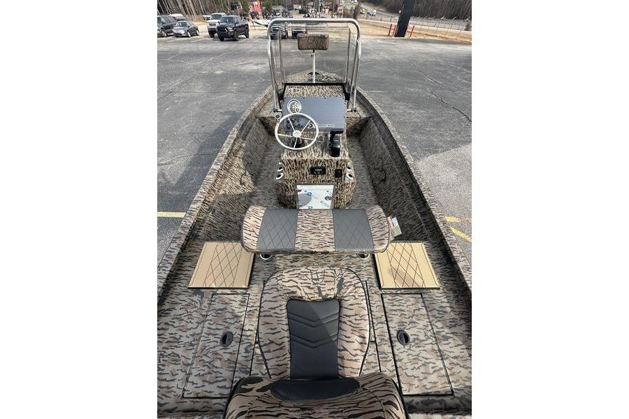 2026 Xpress H190B Bay boat interior with camouflage design and steering console.