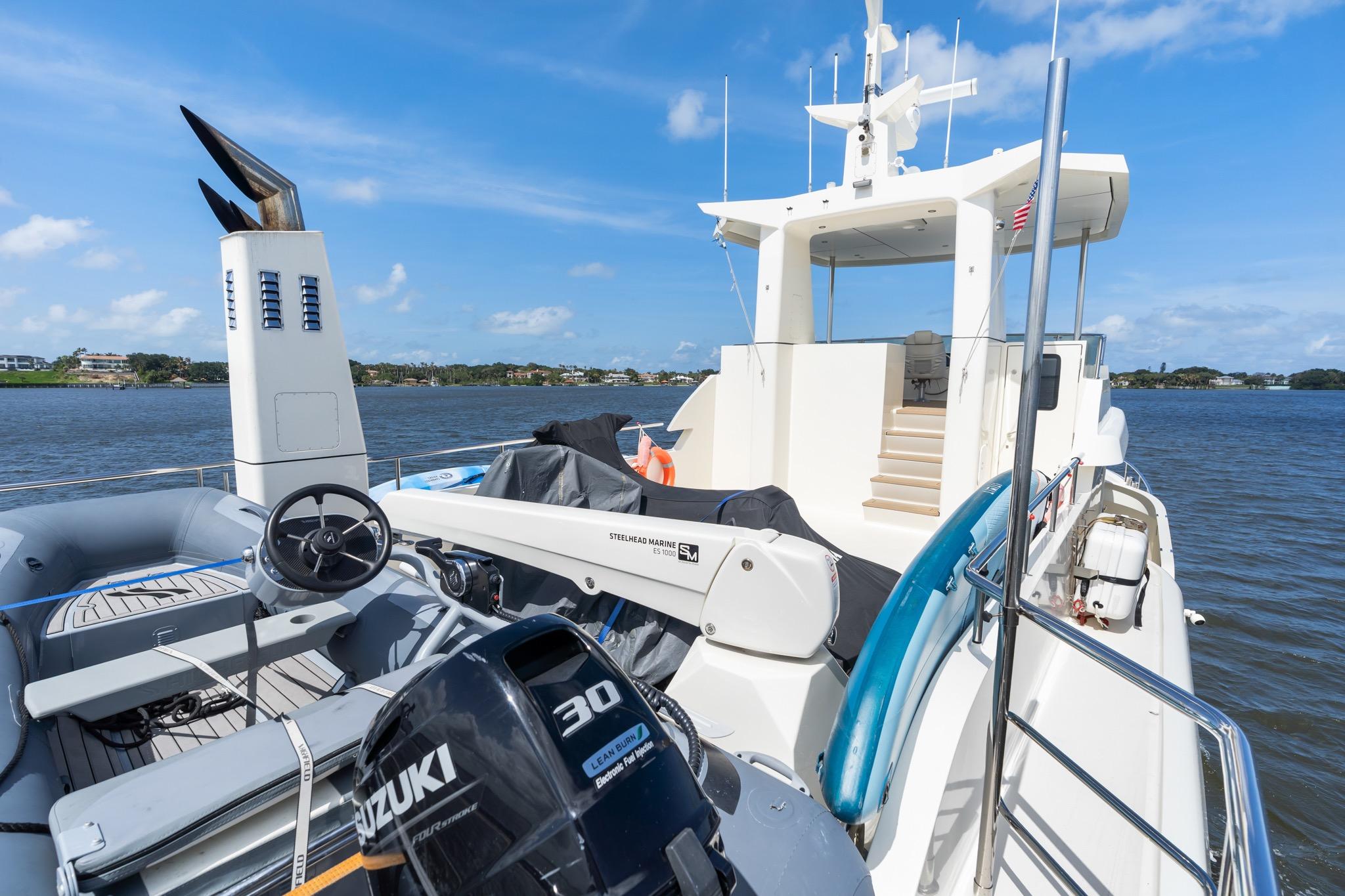 2022 Alm Trawler Delfino 64 yacht with Suzuki engine, cruising on a sunny day.