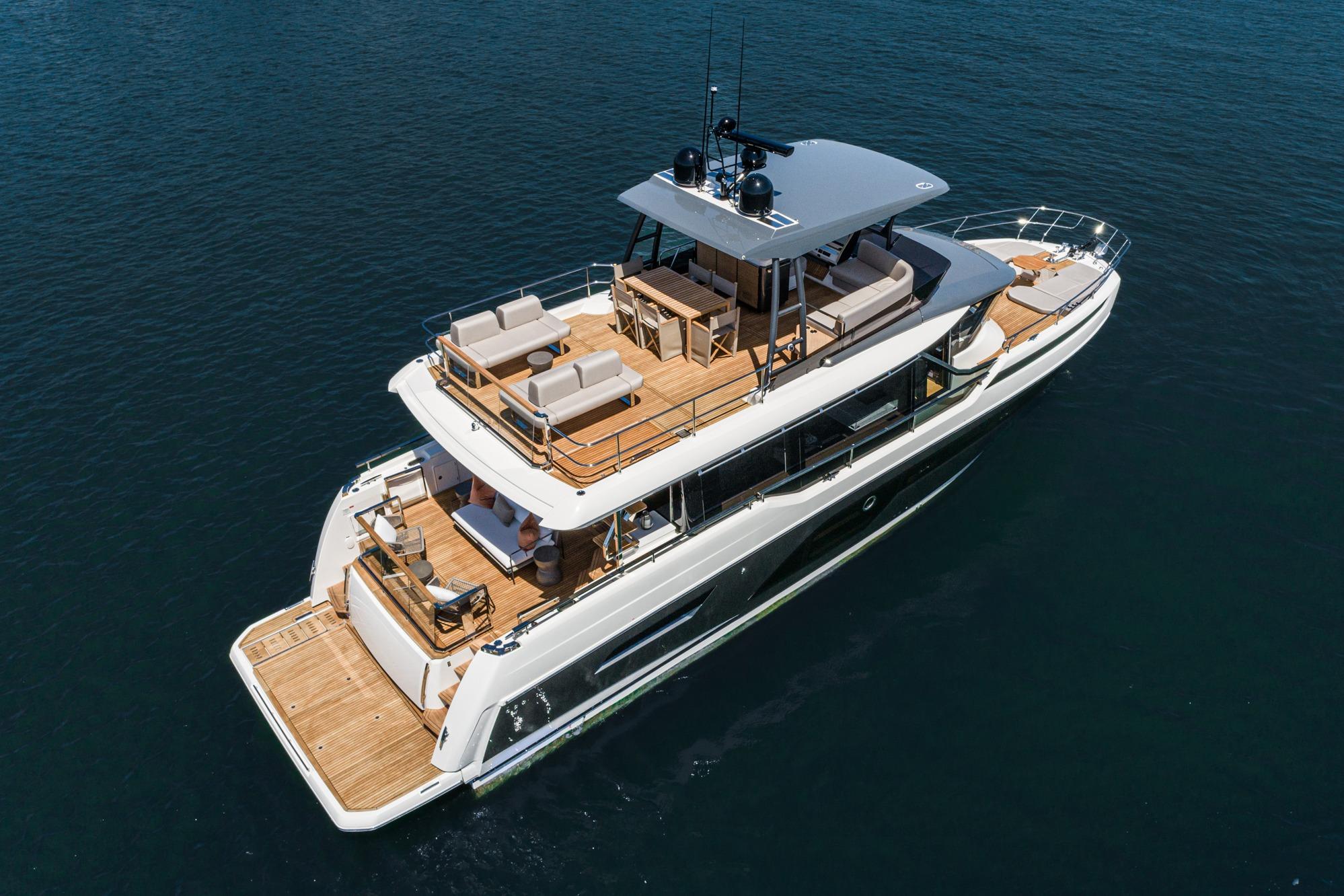 Luxurious 2024 Prestige X60 yacht with spacious decks cruising on calm waters.