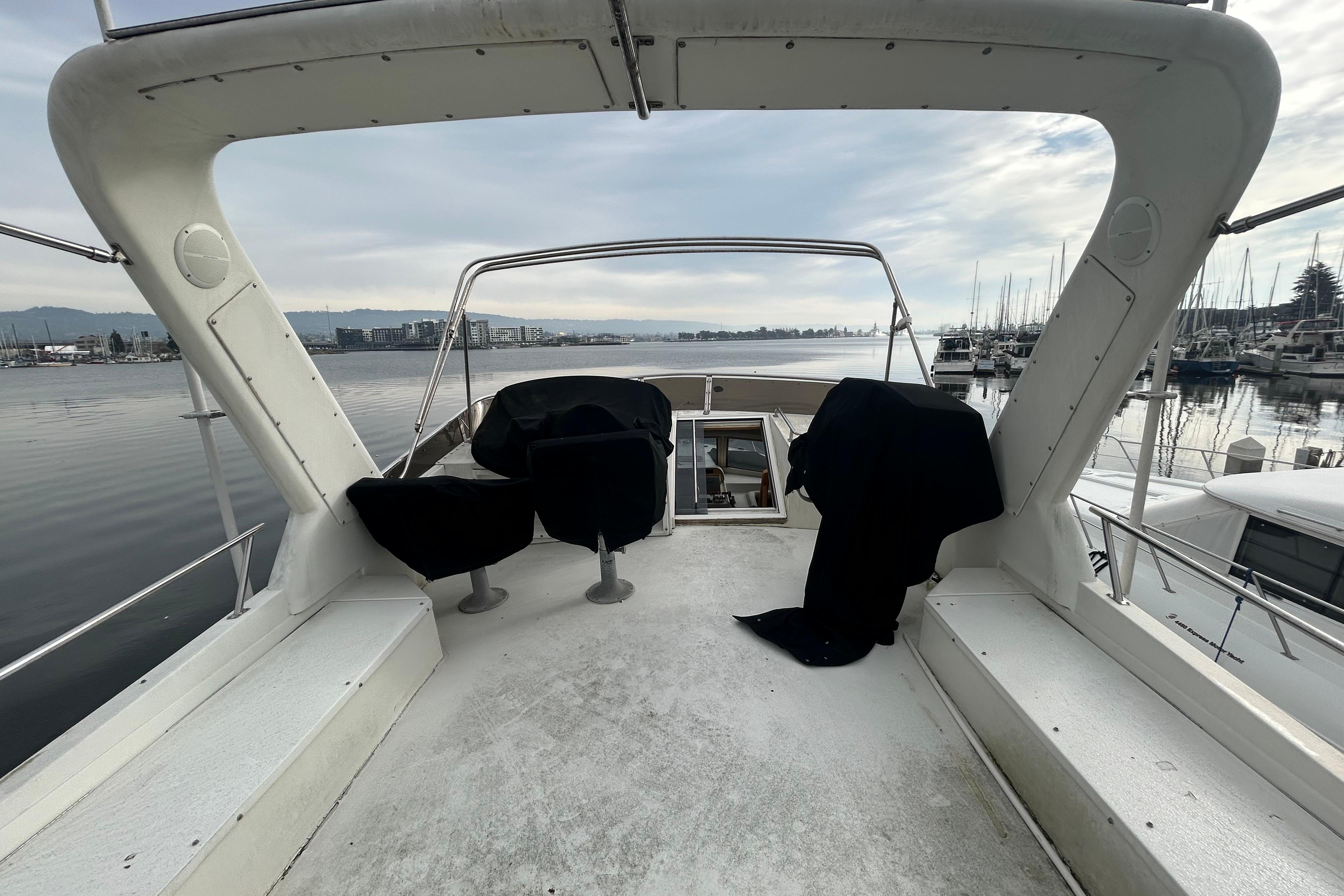 1996 Navigator 53 Classic yacht deck with marina view, overcast sky.