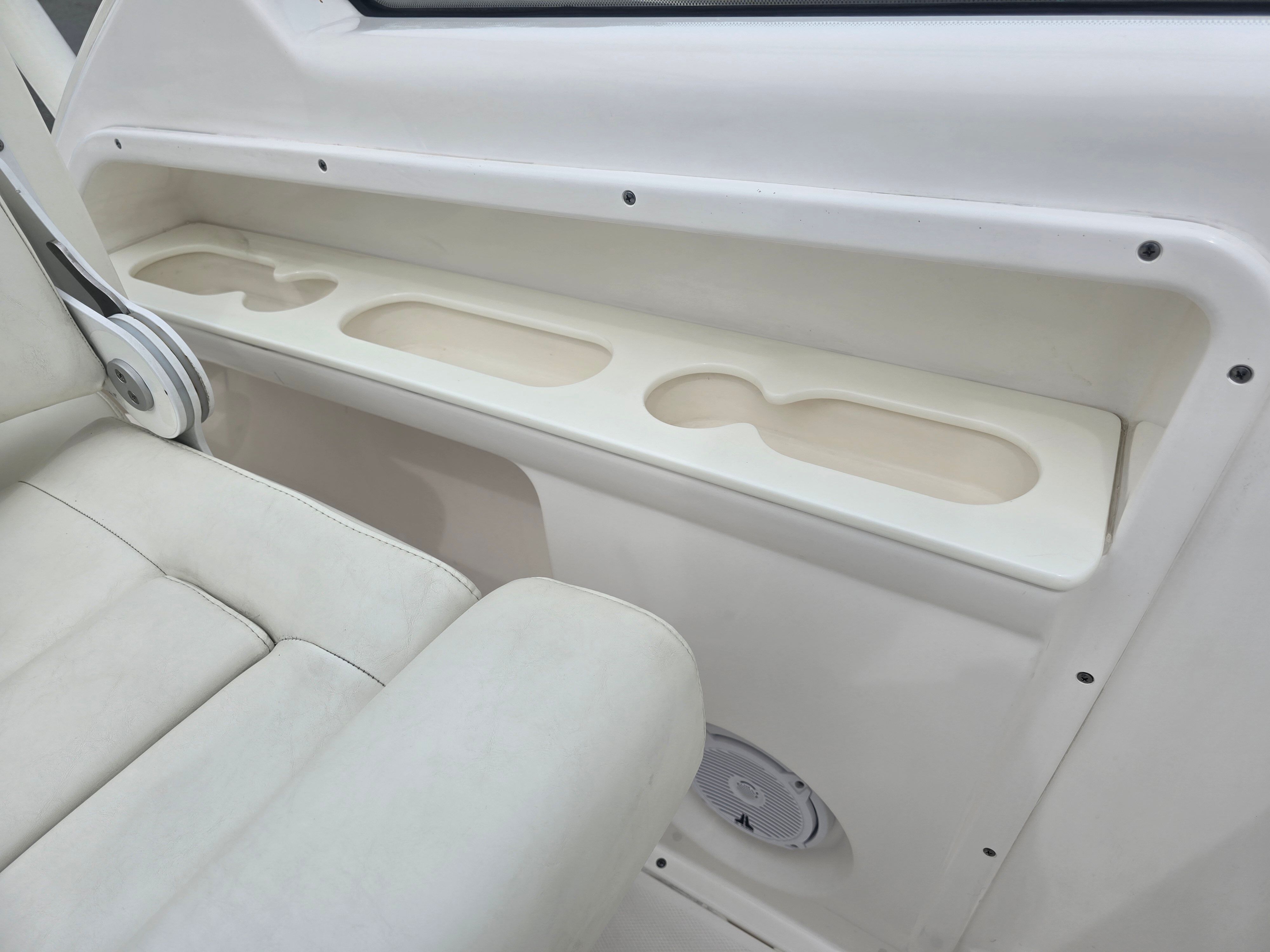 Interior view of a 2017 Everglades 230 Dual Console boat with cup holders.