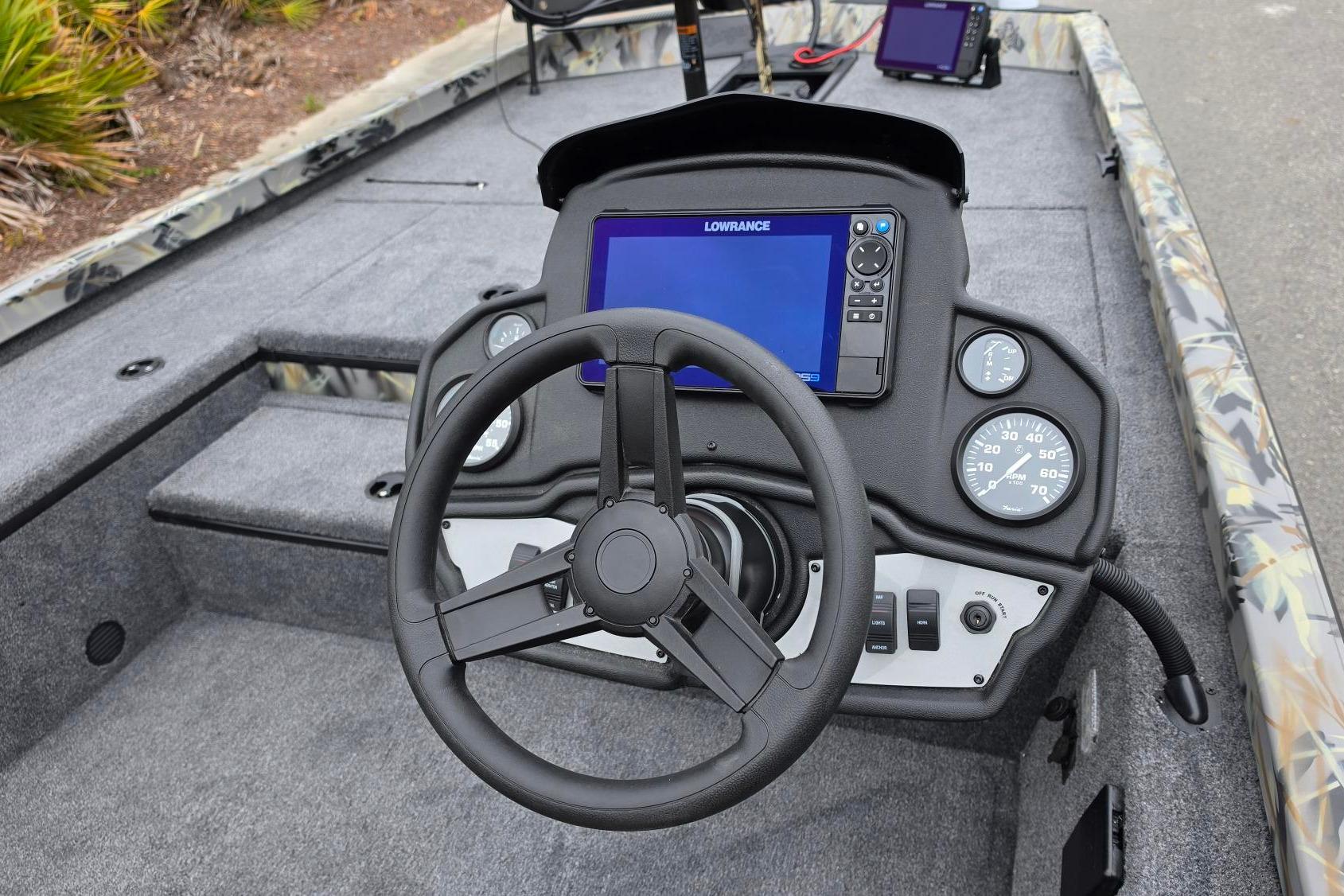 2026 Ranger RT178 boat dashboard with steering wheel and digital display.