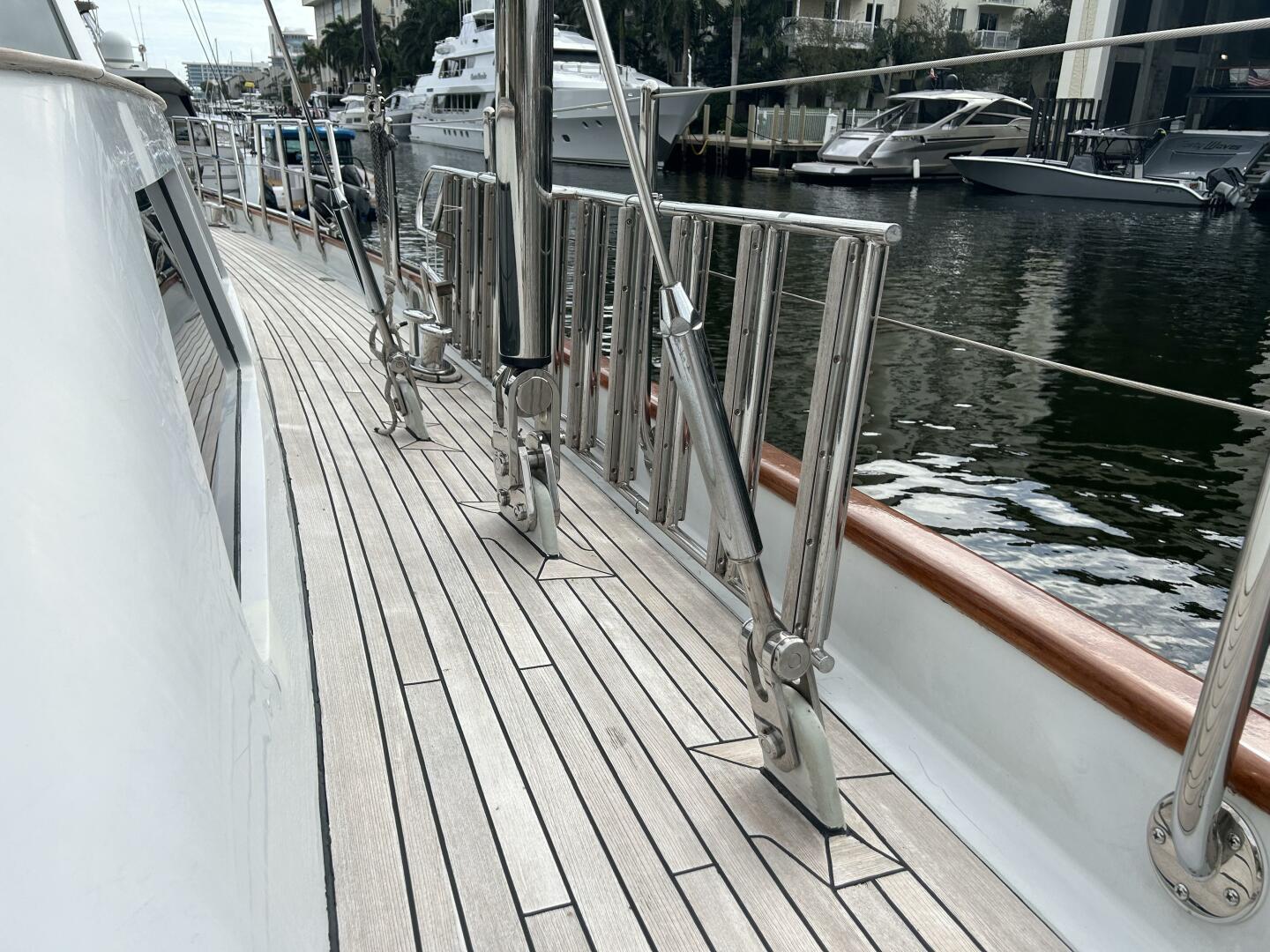 Deck view of 1983 Palmer Johnson 110 Cruising Sloop yacht in marina.