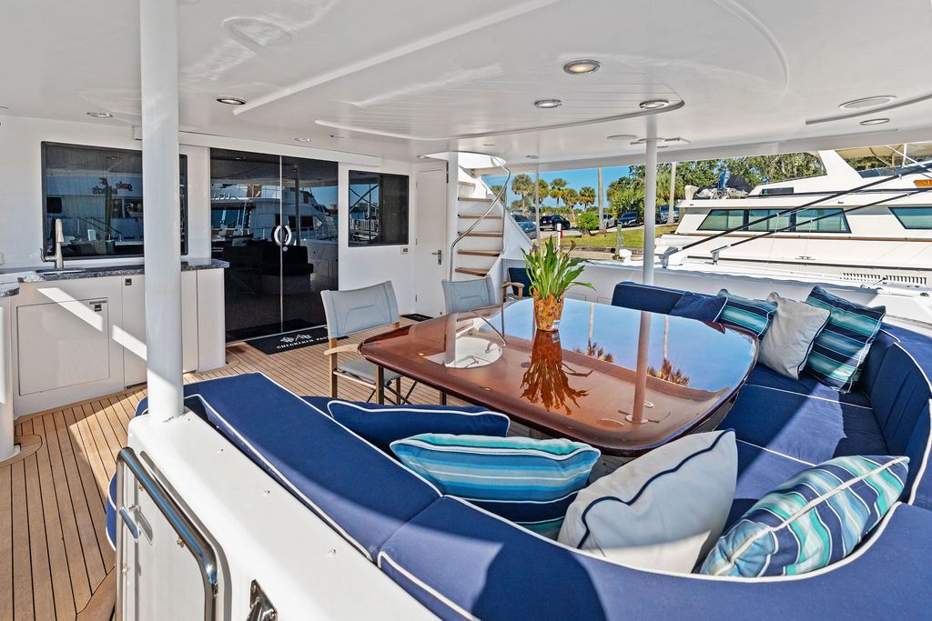 Luxurious Westport 112 yacht deck area with elegant seating, built in 1999.