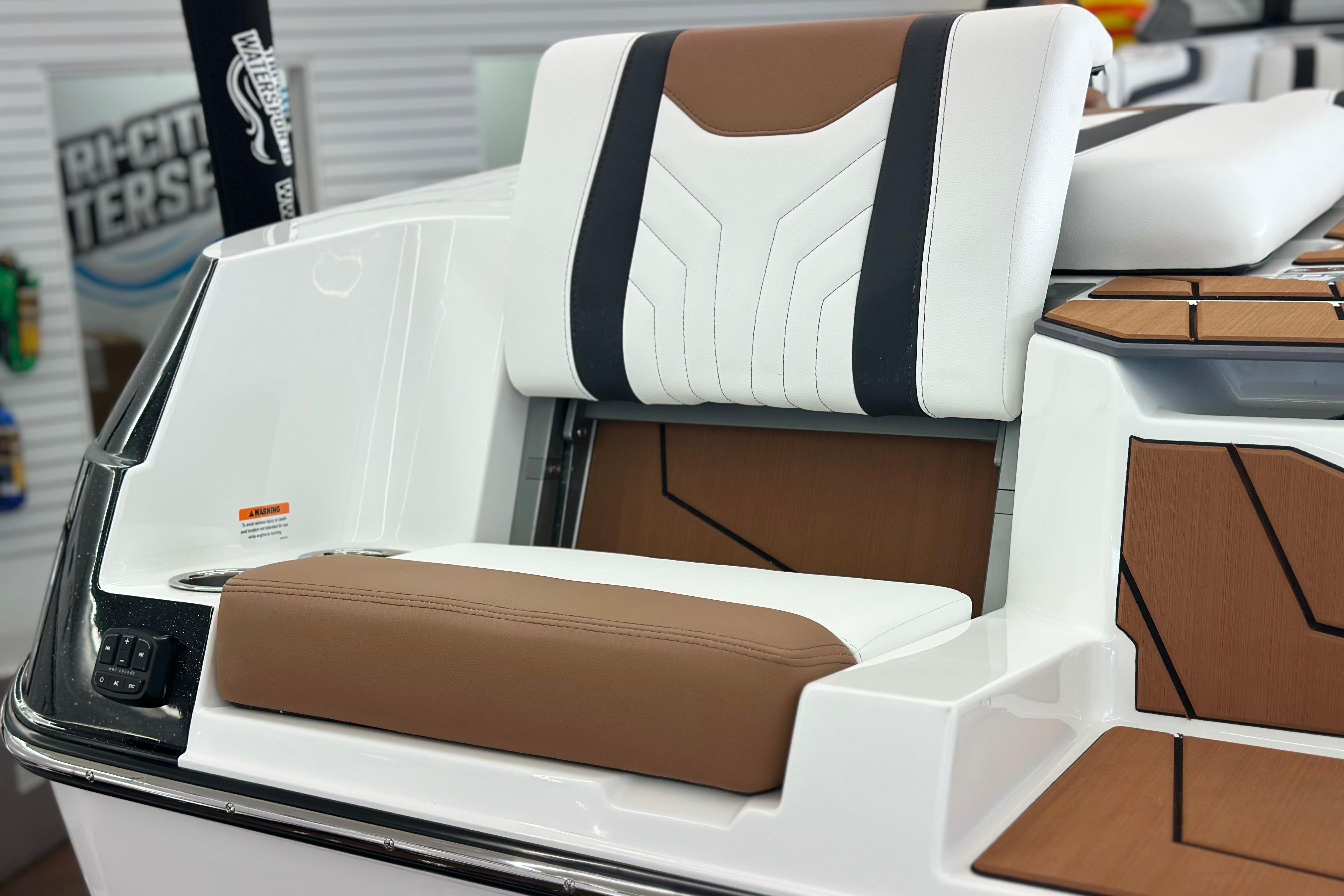 2026 Malibu Wakesetter 25 LSV boat seat with brown and white upholstery.