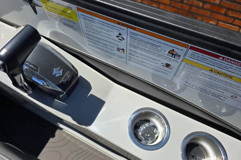 Control panel of 2026 Berkshire STS Arch Performance Series boat with warning labels.