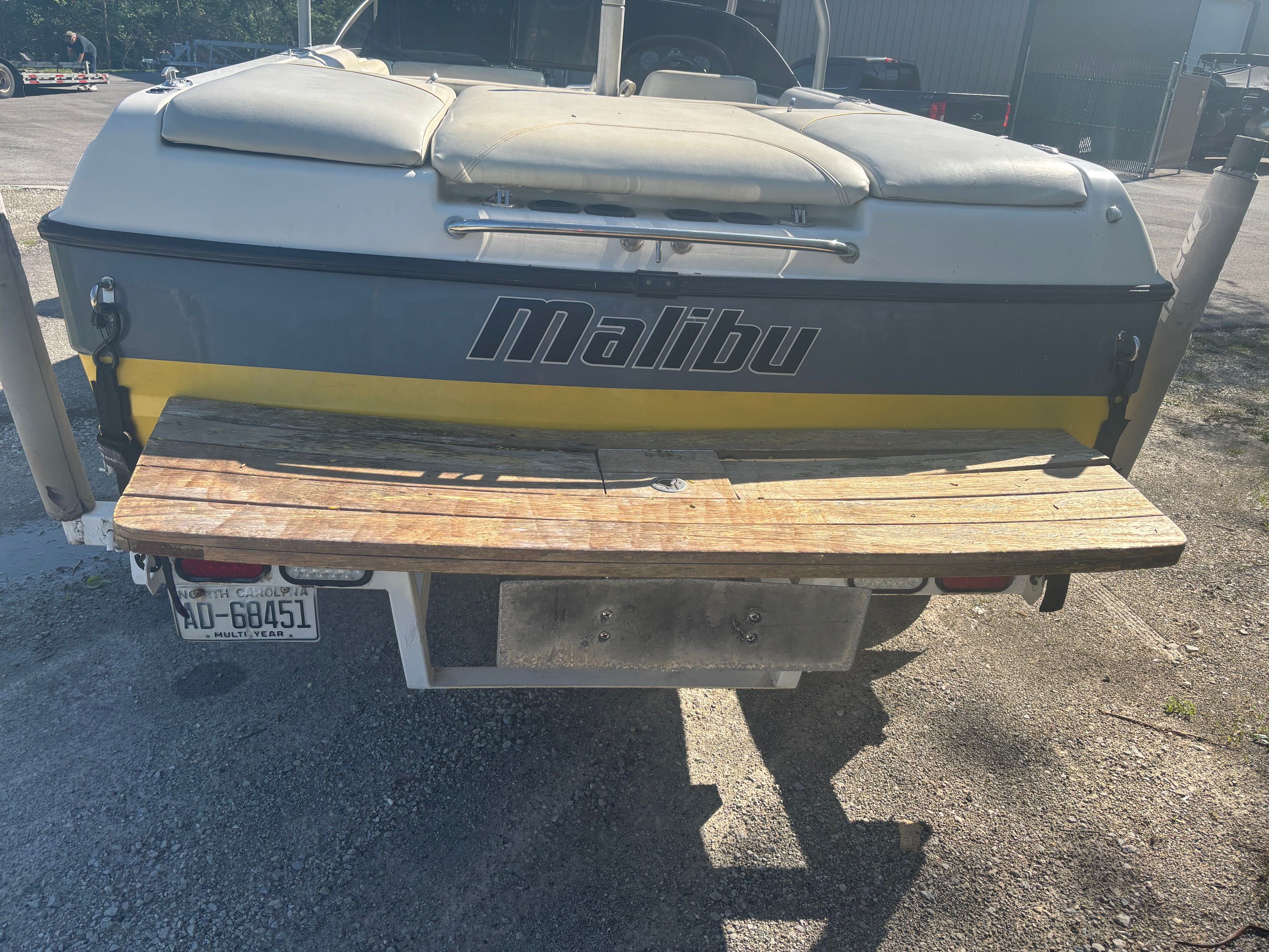 Rear view of a 2000 Malibu Wakesetter VLX boat on a trailer.