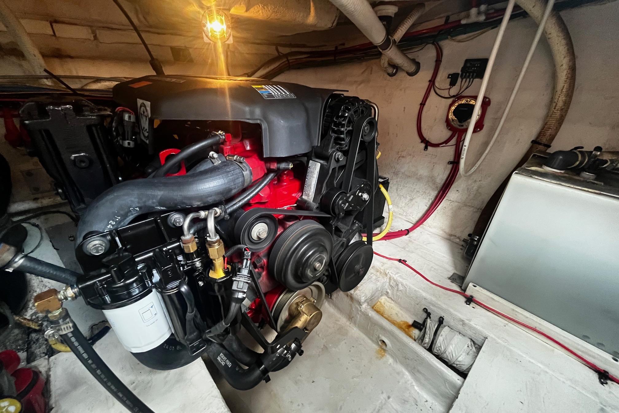 Engine room of 2004 Cruisers Yachts 280 CXi Express, showcasing detailed mechanical components.
