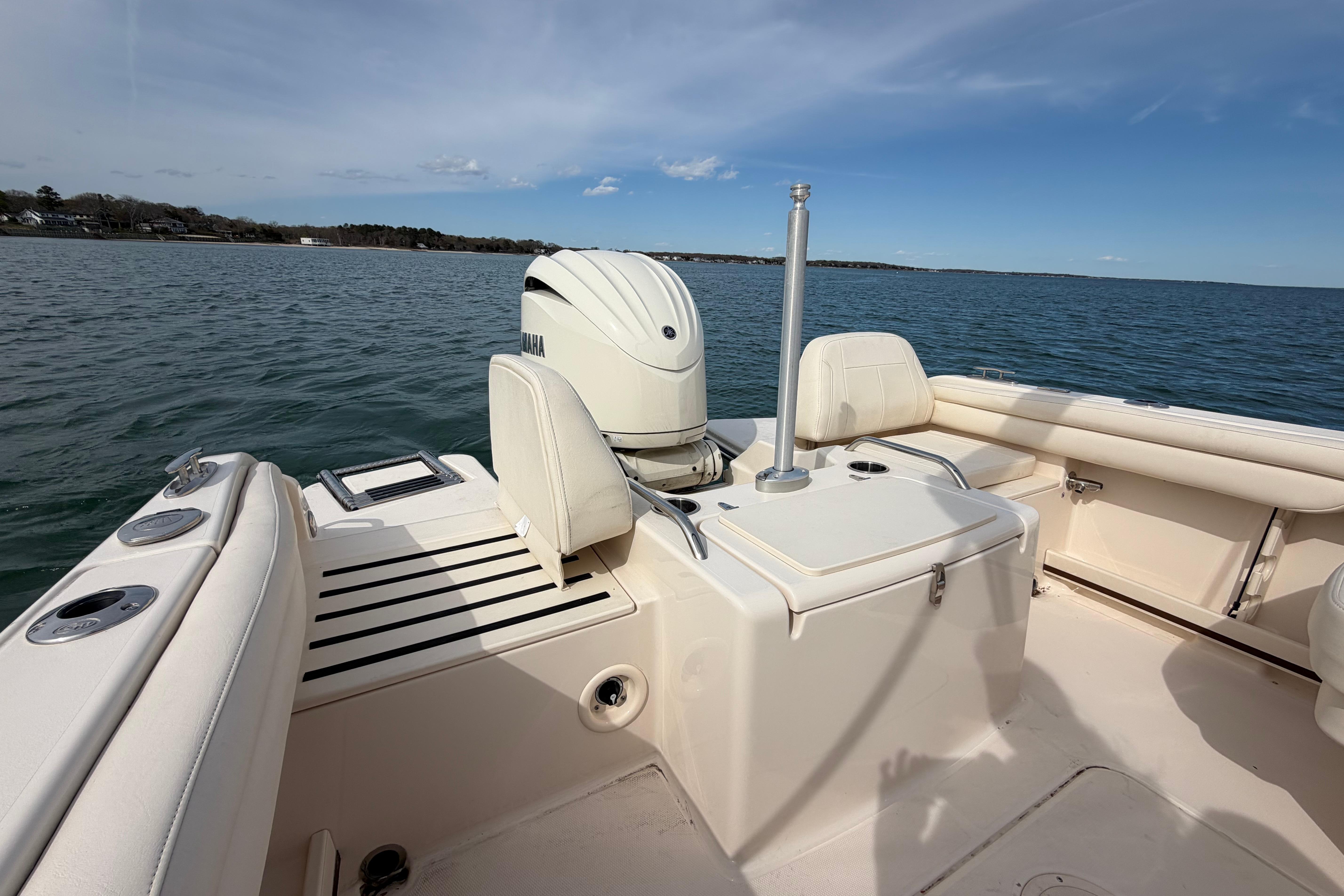 2025 Grady-White Freedom 215 boat on water, featuring Yamaha outboard motor.