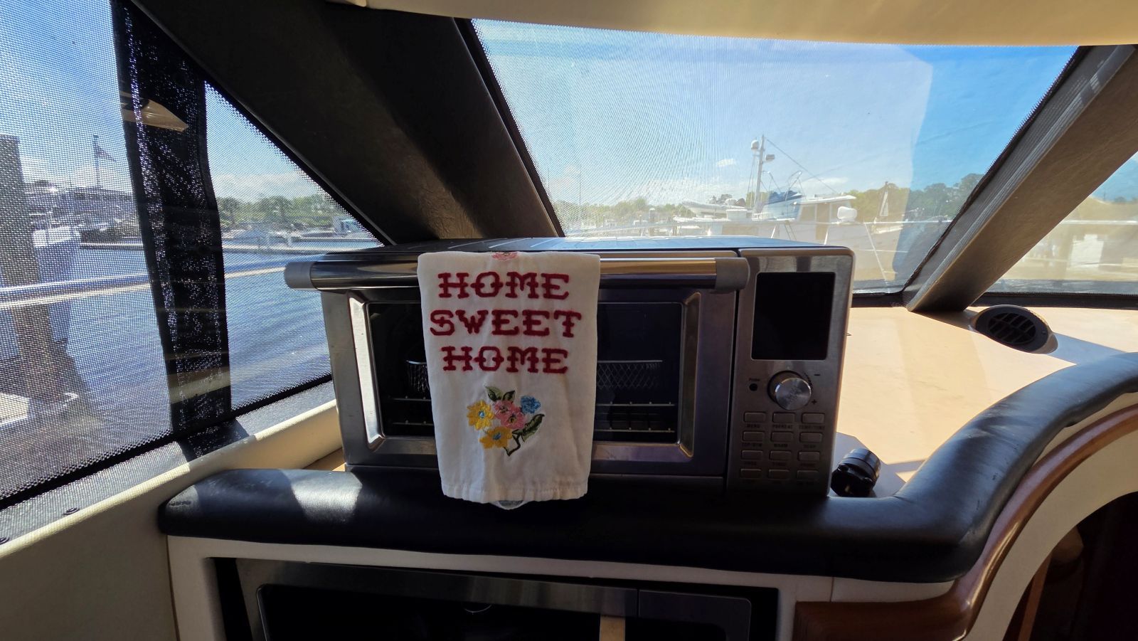 Interior of Carver 450 Voyager Pilothouse with "Home Sweet Home" towel.