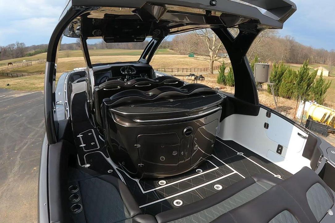 2018 MTI V42 boat interior with sleek design and modern features, set in a rural landscape.