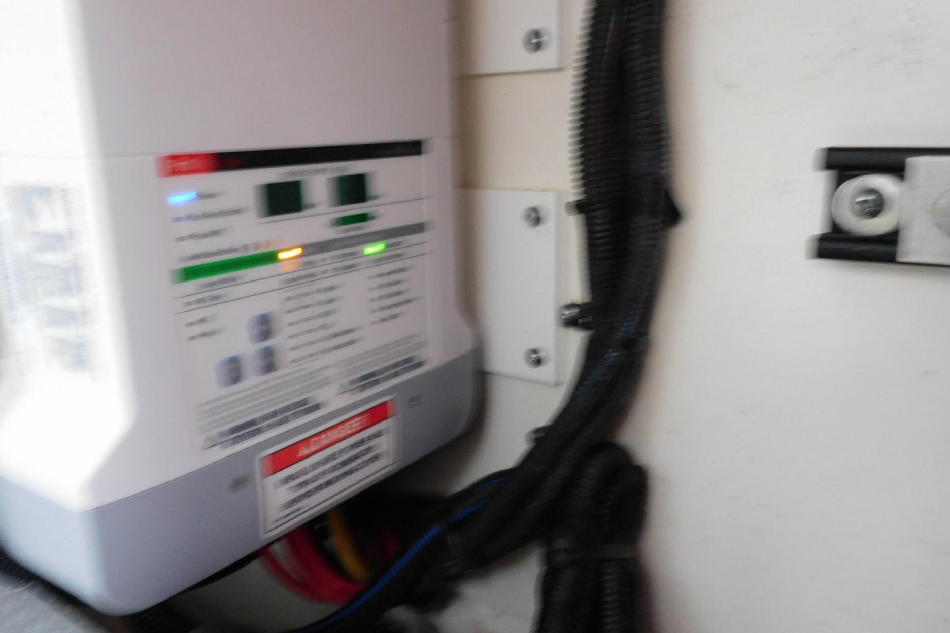 Electrical panel inside a 2019 Sea Ray L550 yacht, featuring wiring and control indicators.