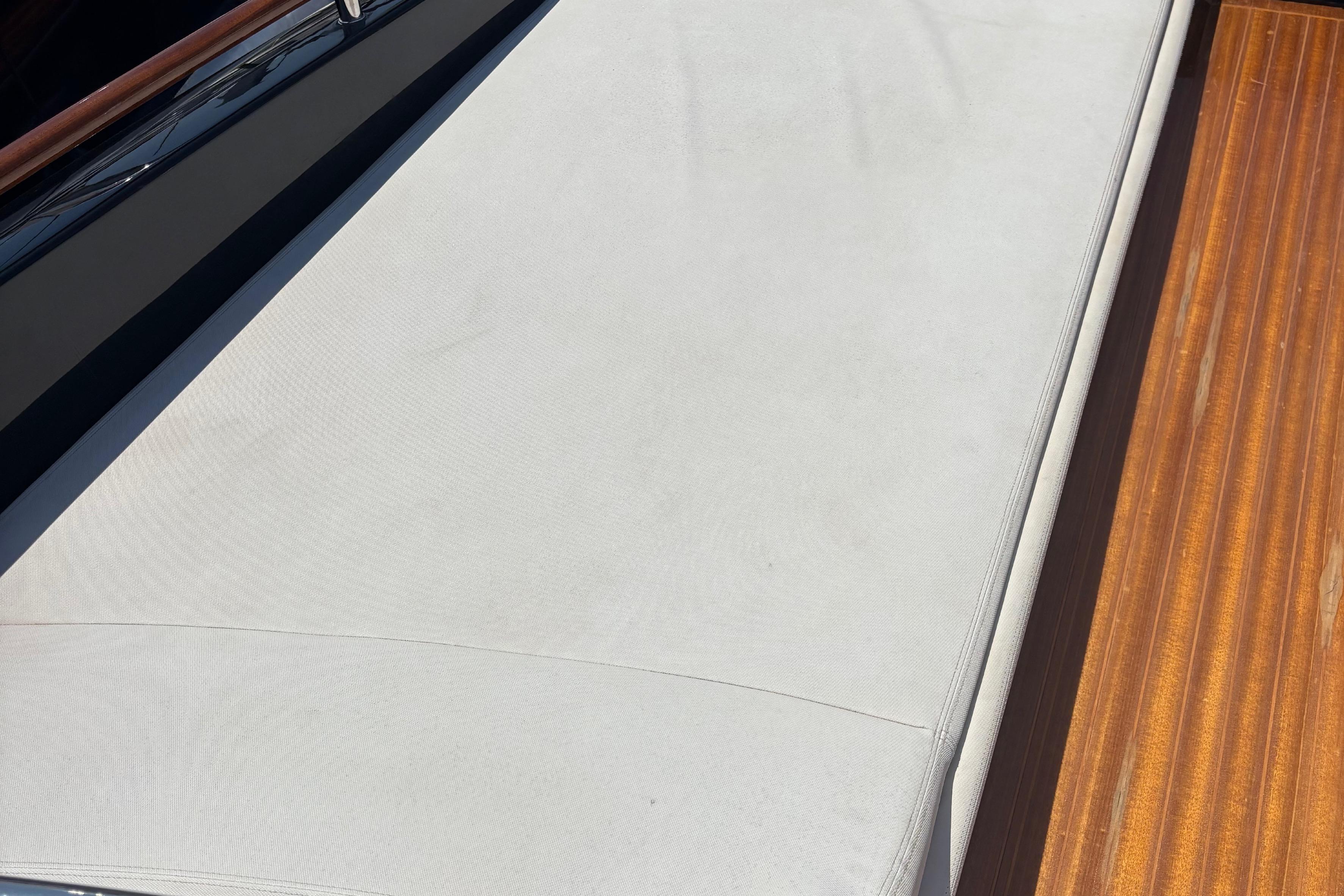 Riva Rivarama Super 44 yacht deck, 2012 model, featuring sleek wood and upholstery.