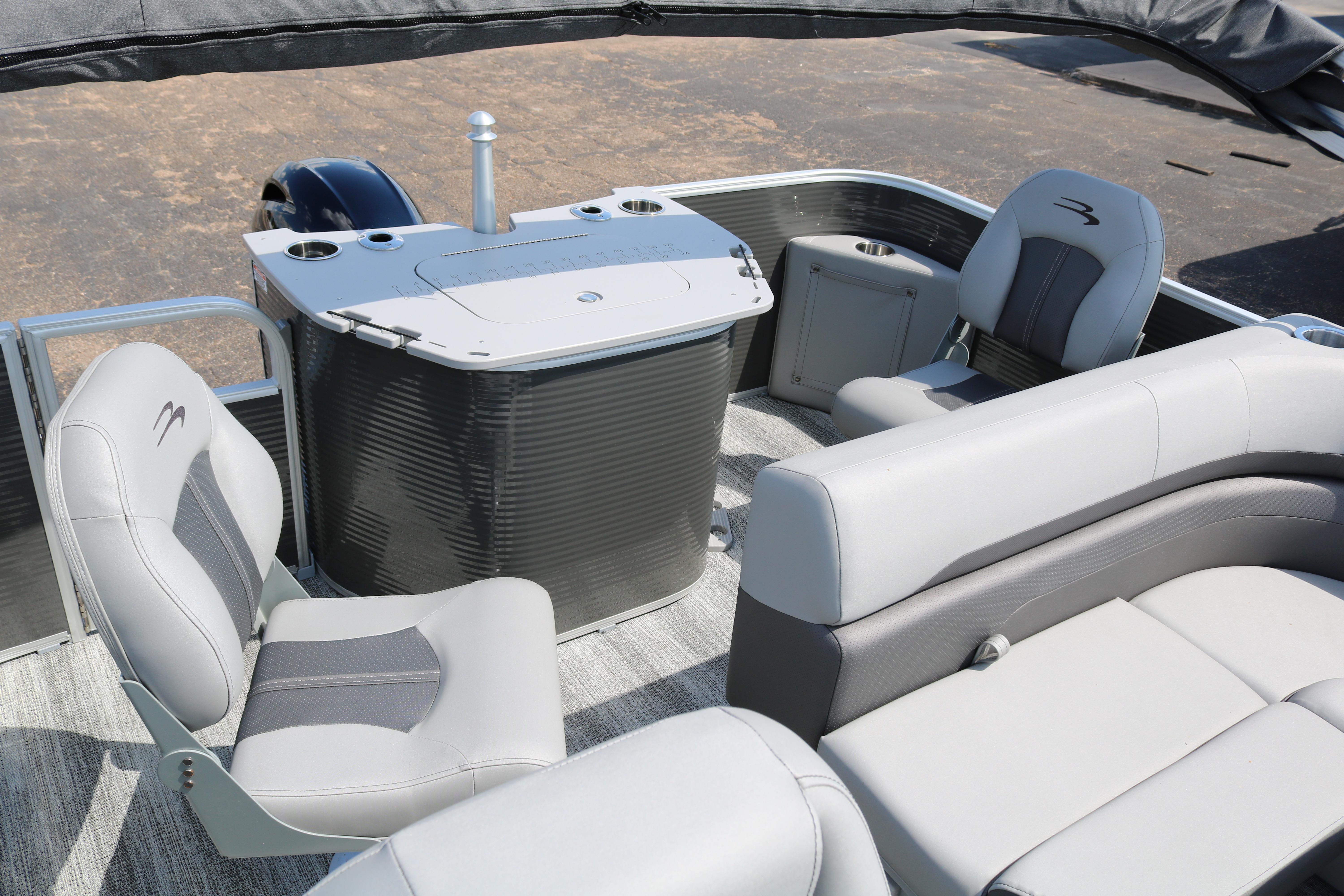 2026 Bennington 20SXSNP Rear Fish pontoon boat interior with seating and console.