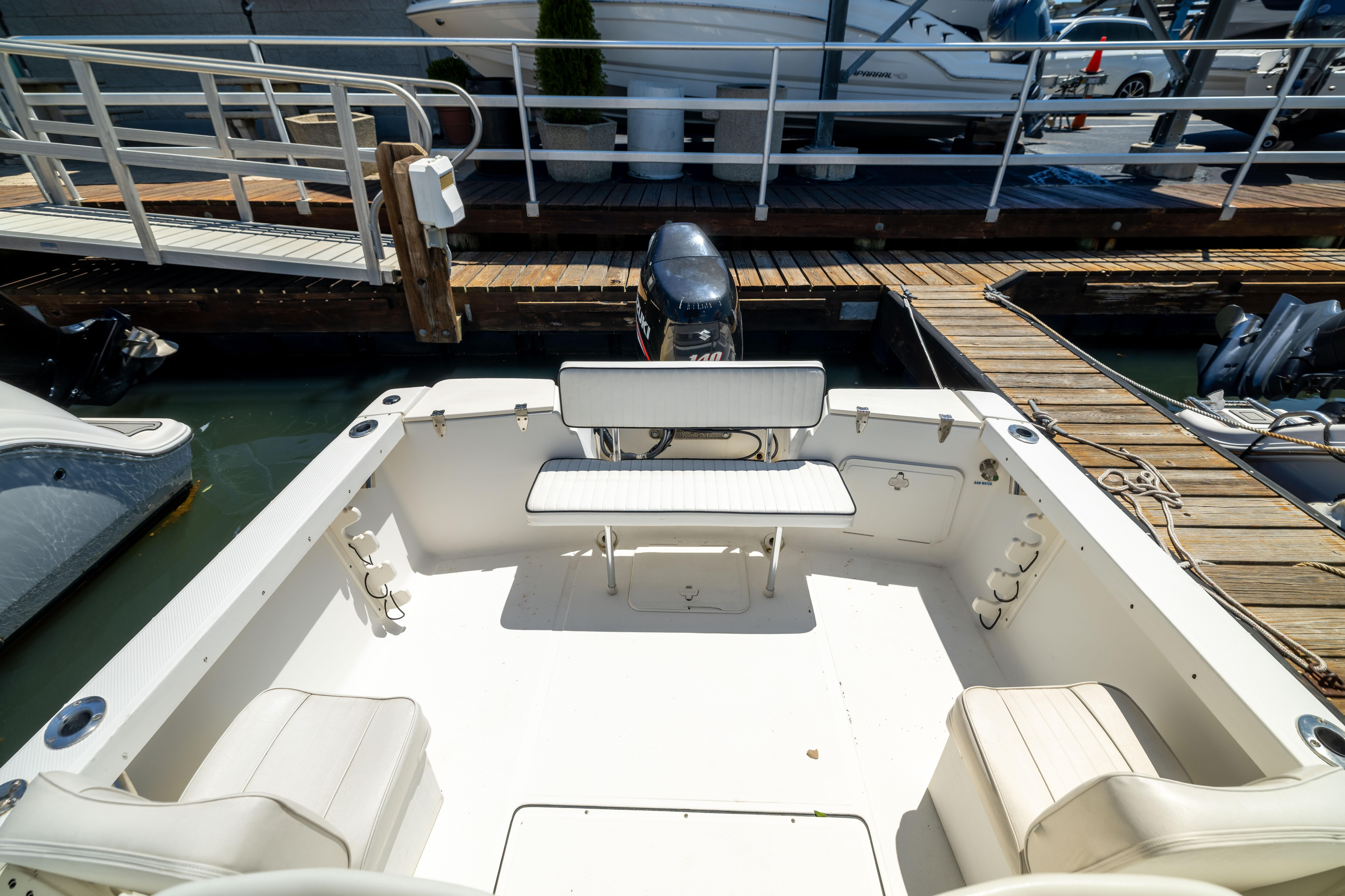 Open deck of a 2012 KEYWEST 2020 WA boat docked at a marina.