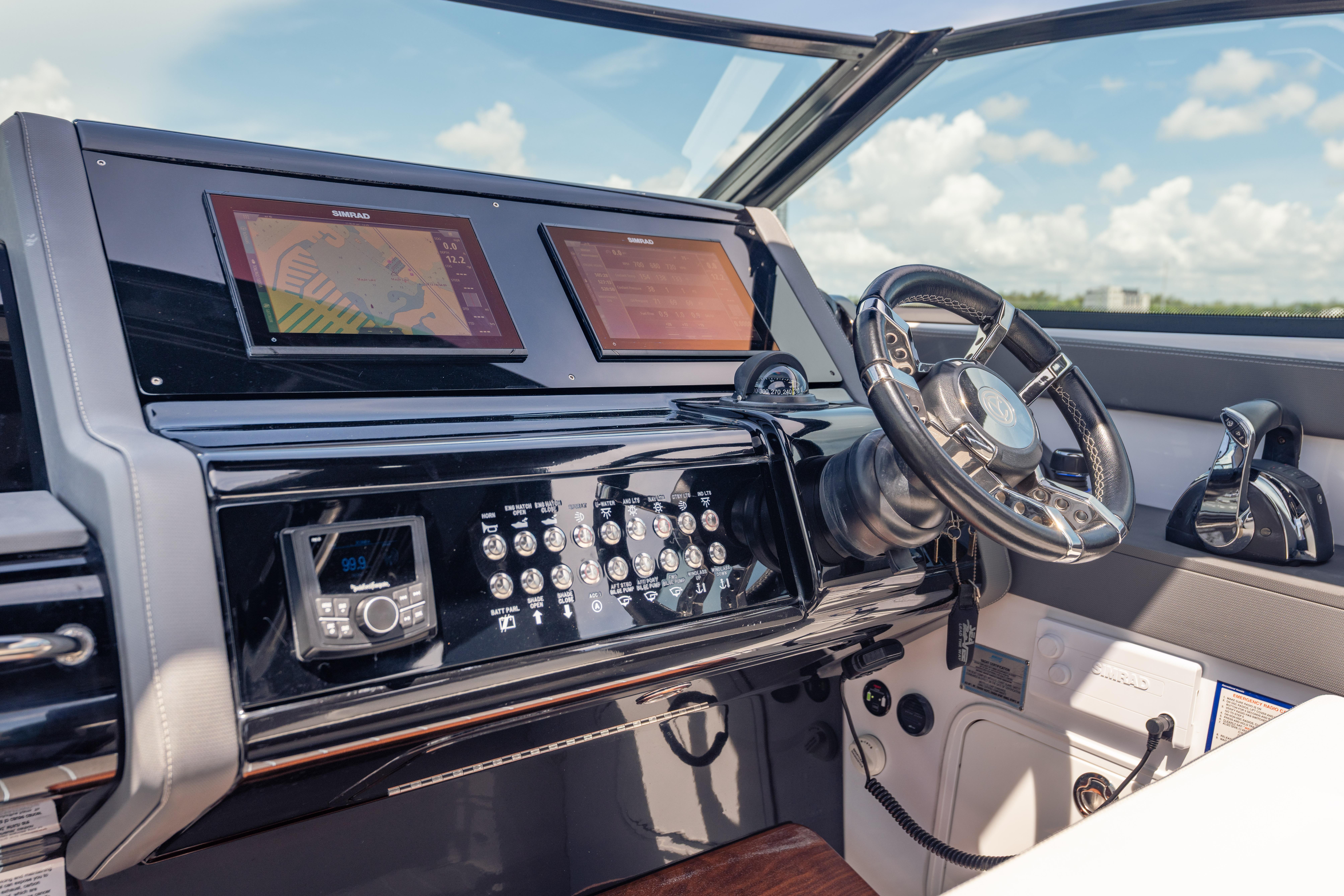 Helm of 2021 Cruisers Yachts 38 GLS with modern navigation displays and controls.