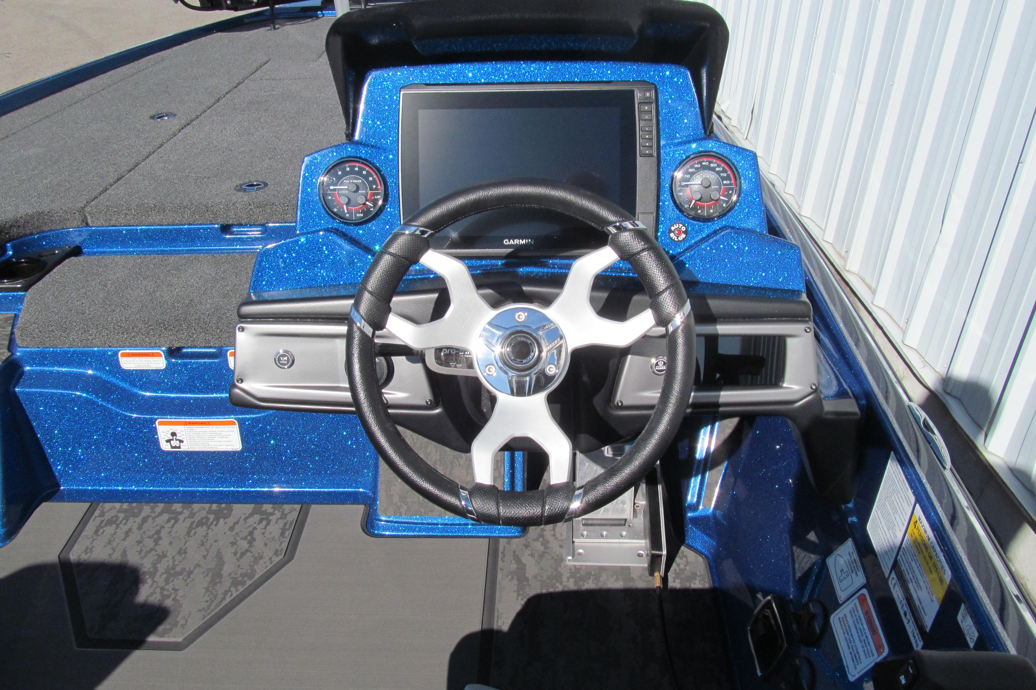 2026 Nitro Z20 XL Pro boat dashboard with steering wheel and digital display.