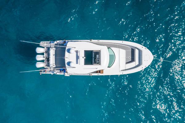 Manufacturer Provided Image: Aerial view of 2026 Regal 38 SAV yacht on clear blue water.