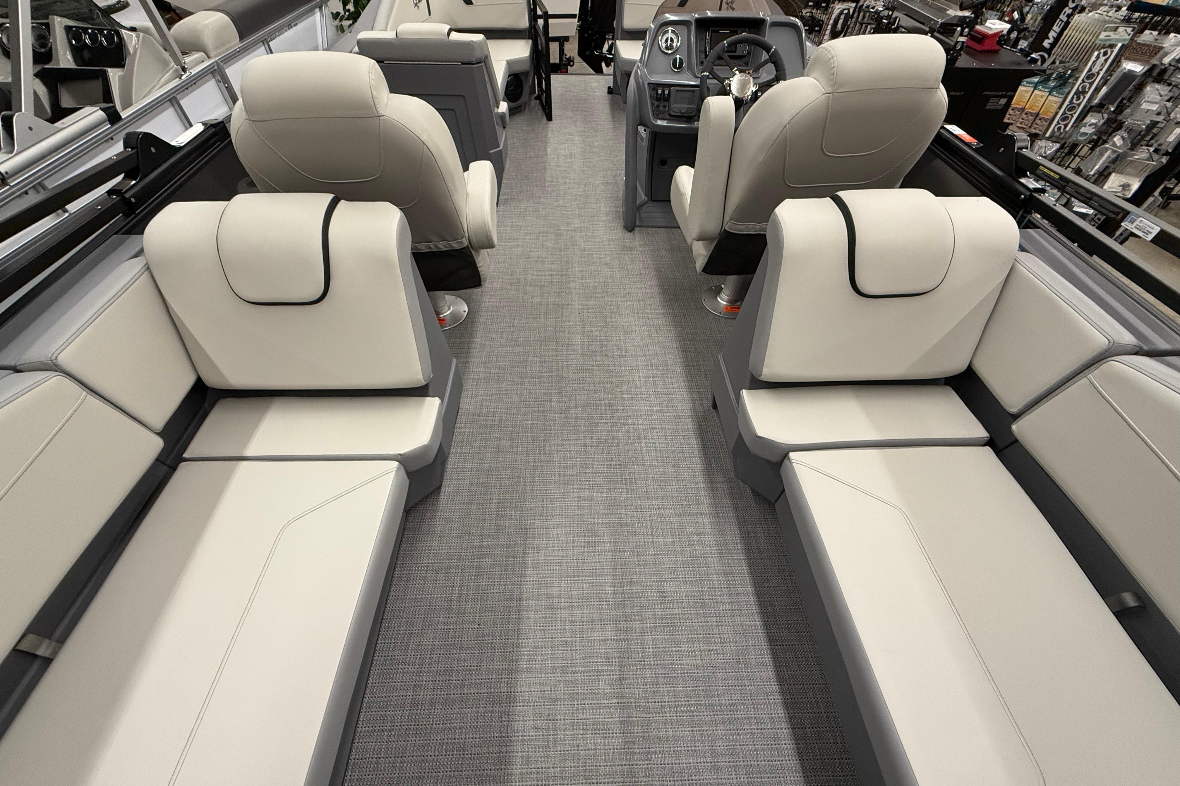 Luxurious interior of 2025 SunChaser Lucerne 22 LR DH pontoon boat with plush seating.
