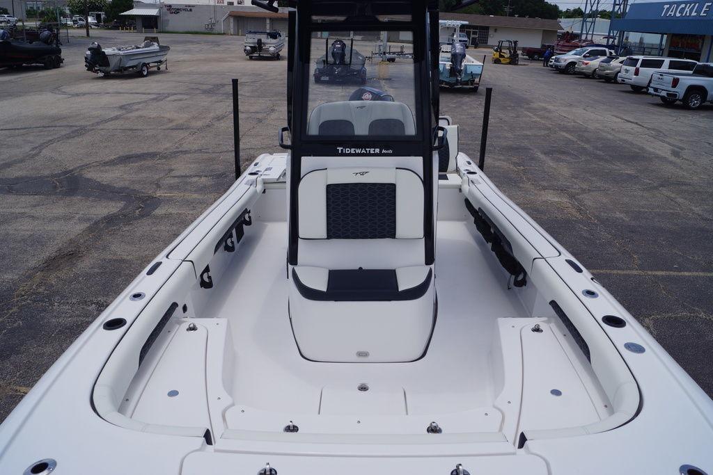 2027 Tidewater 2500 Carolina Bay boat, spacious deck, parked in a marina.