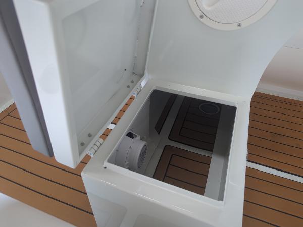 Open storage compartment on Tide Craft San Juan 11 boat, 2025 model, with wooden deck.