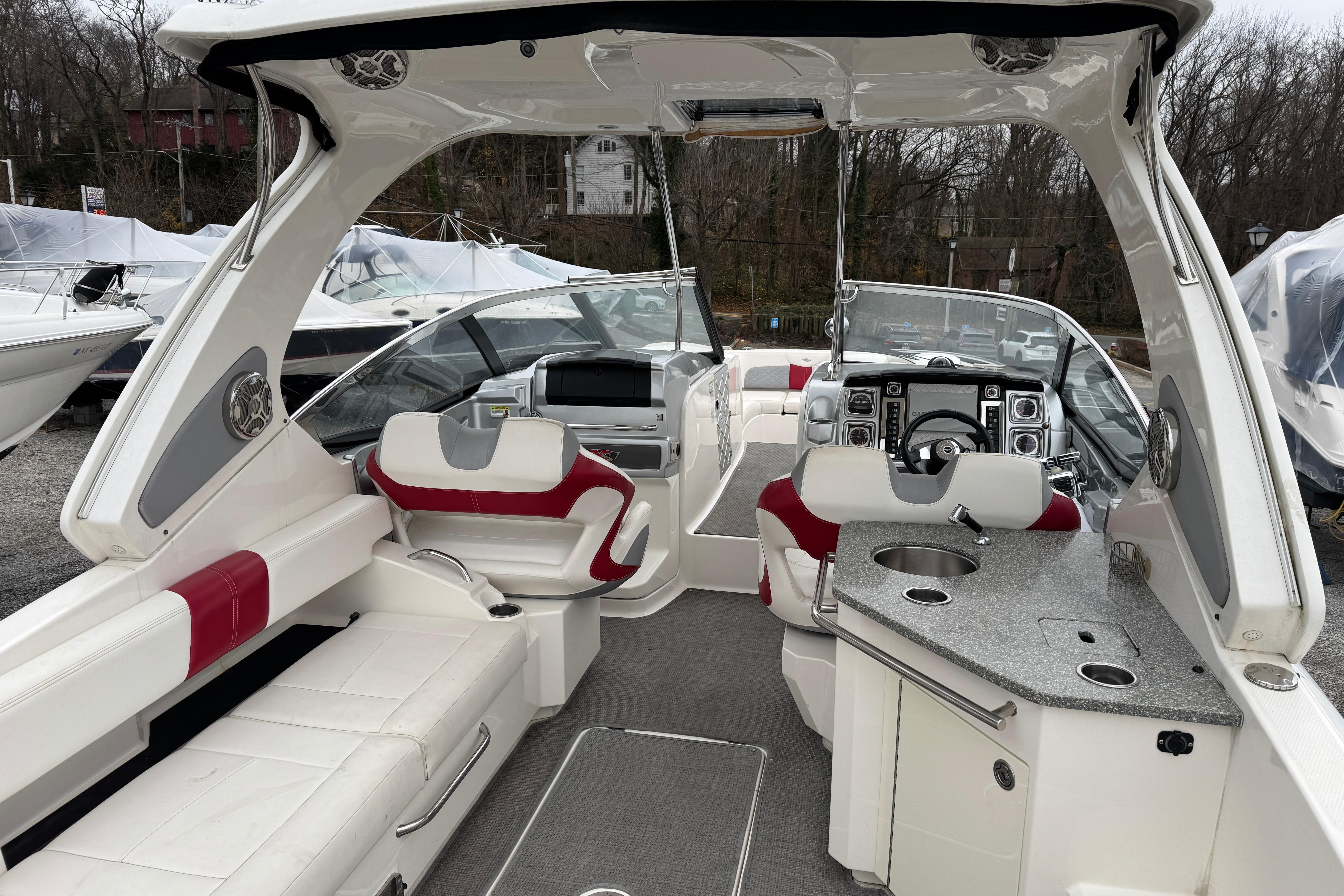 Interior of a 2012 Chaparral 327 SSX boat with luxurious seating and modern amenities.