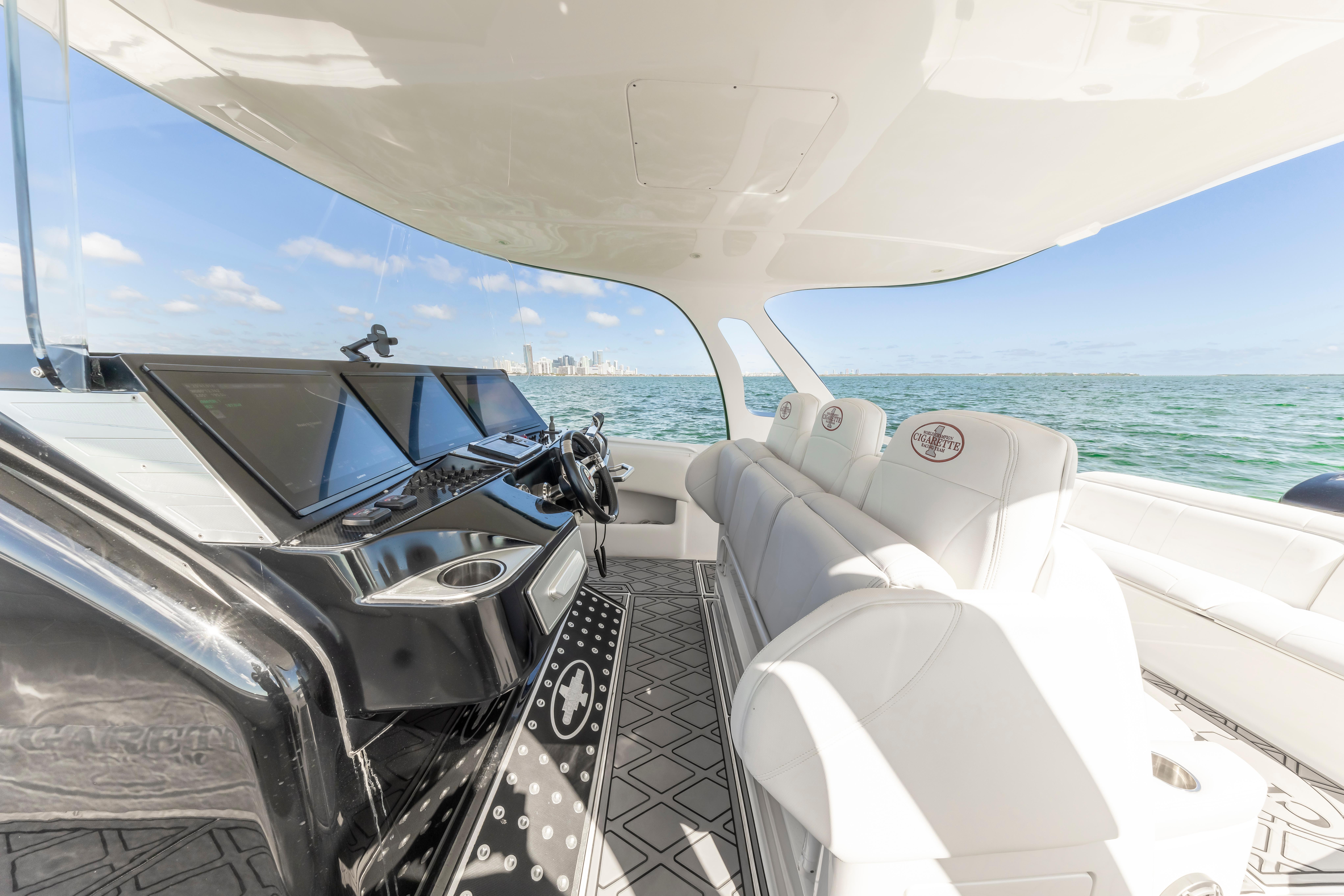 Interior of 2016 Cigarette 41 GTR boat with luxurious seating and ocean view.