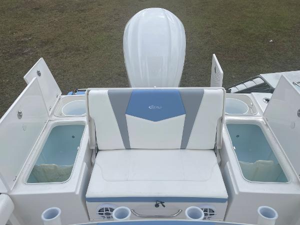 2026 Robalo 246 Cayman boat interior with seating and storage compartments.