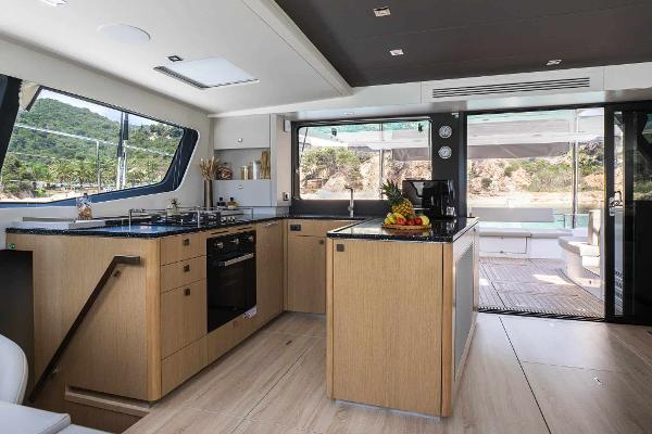 Luxurious 2025 Privilege Signature 580 yacht kitchen with modern design and scenic views.