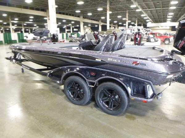 2025 Ranger Z520 boat displayed indoors, featuring sleek design and dual-axle trailer.